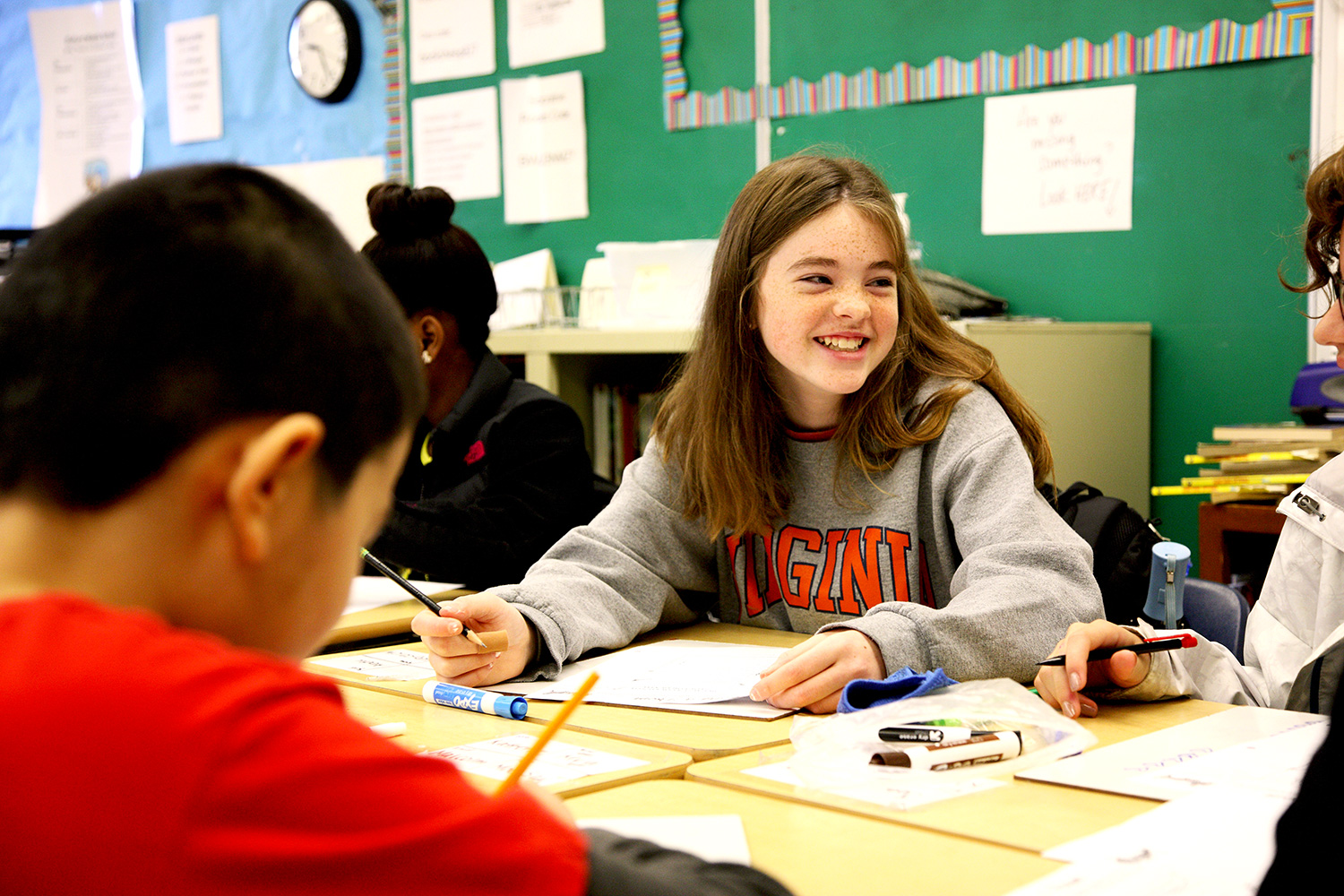 High school students working at desks together