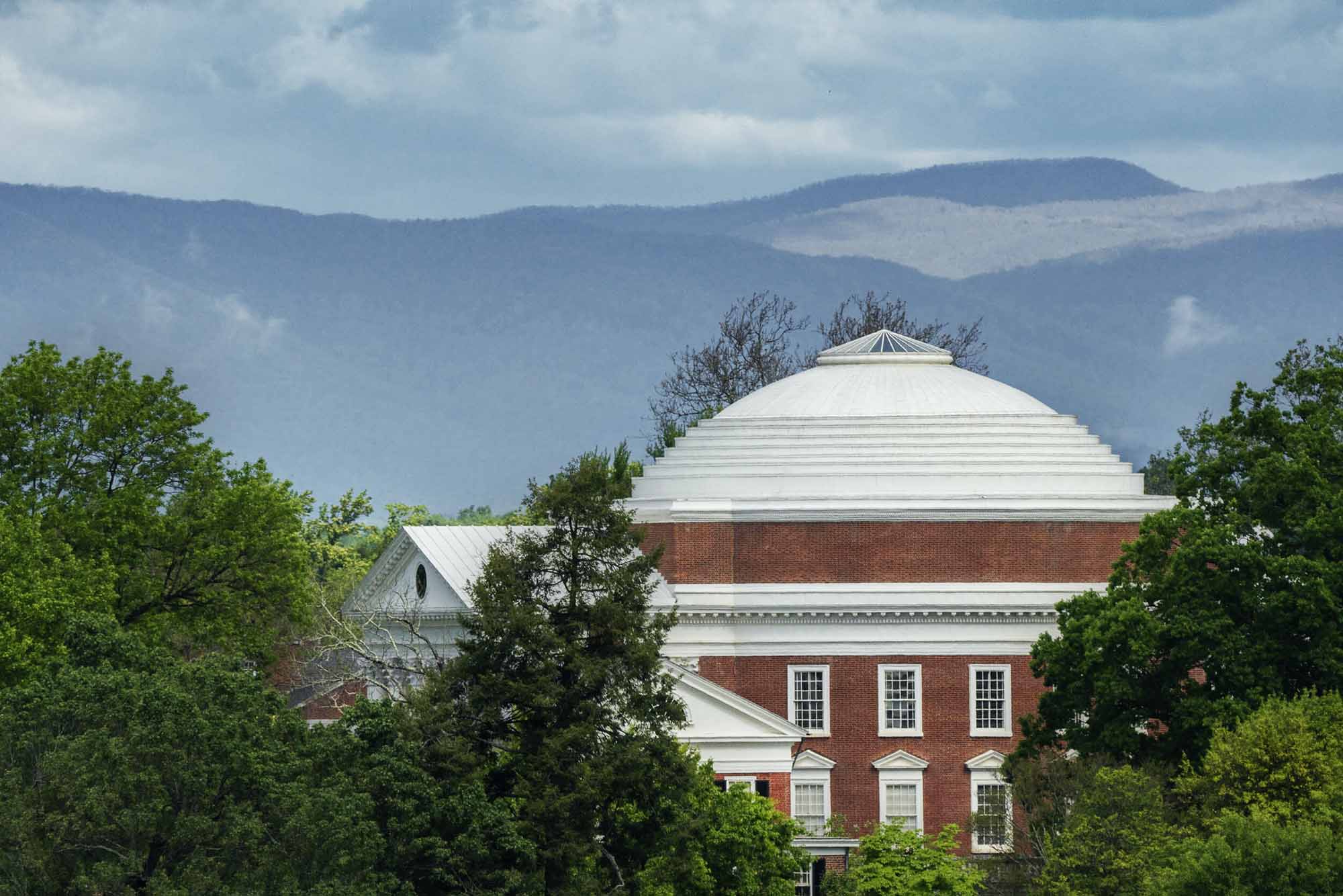 Arial view of the Rotunda backdropped by the Blue Ridge Mountain