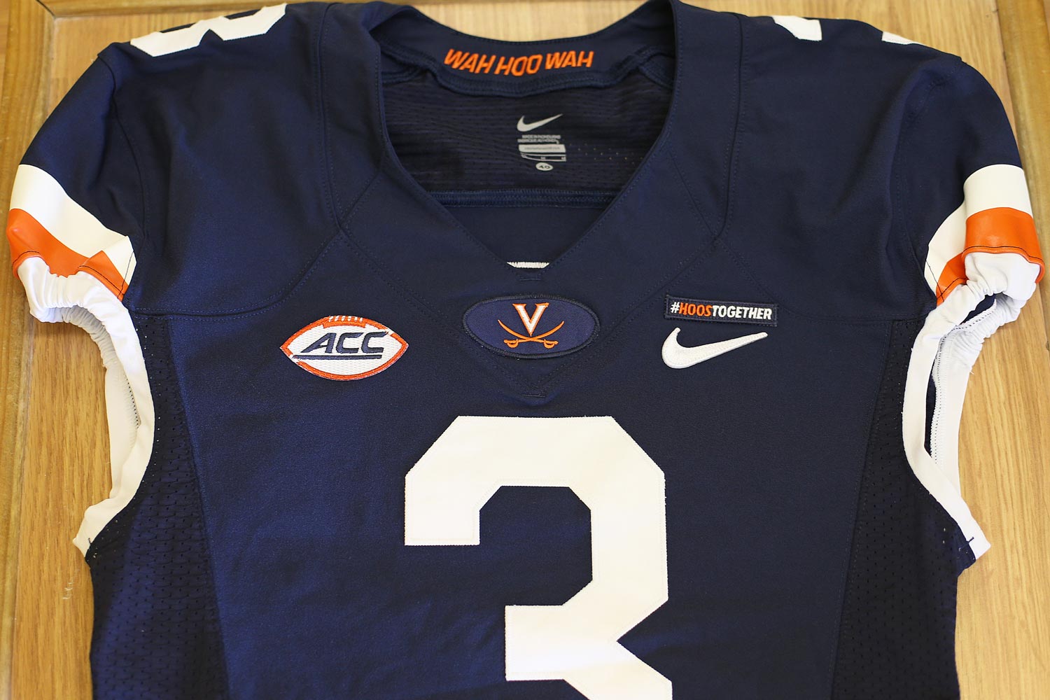 UVA Athletic uniform with a  #HoosTogether patch on it.