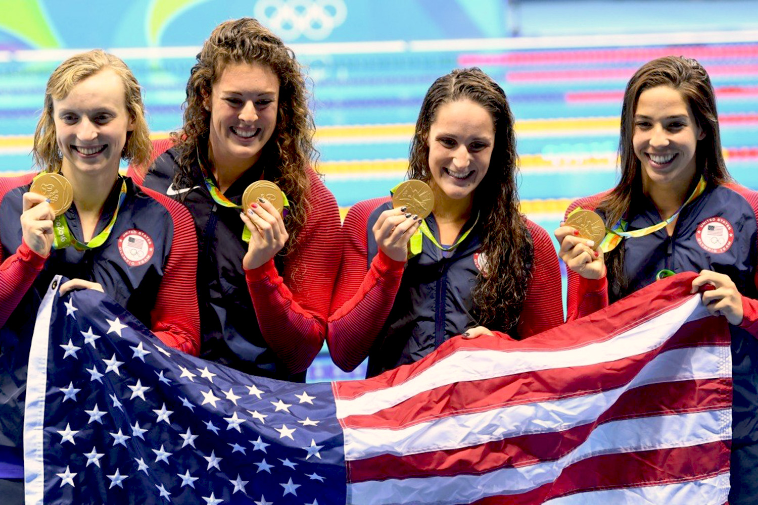 UVA swimmer Leah Smith, second from right, celebrates her gold medal with U.S. relay teammates, left to right, Katie Ledecky, Allison Schmitt and Maya DiRado.