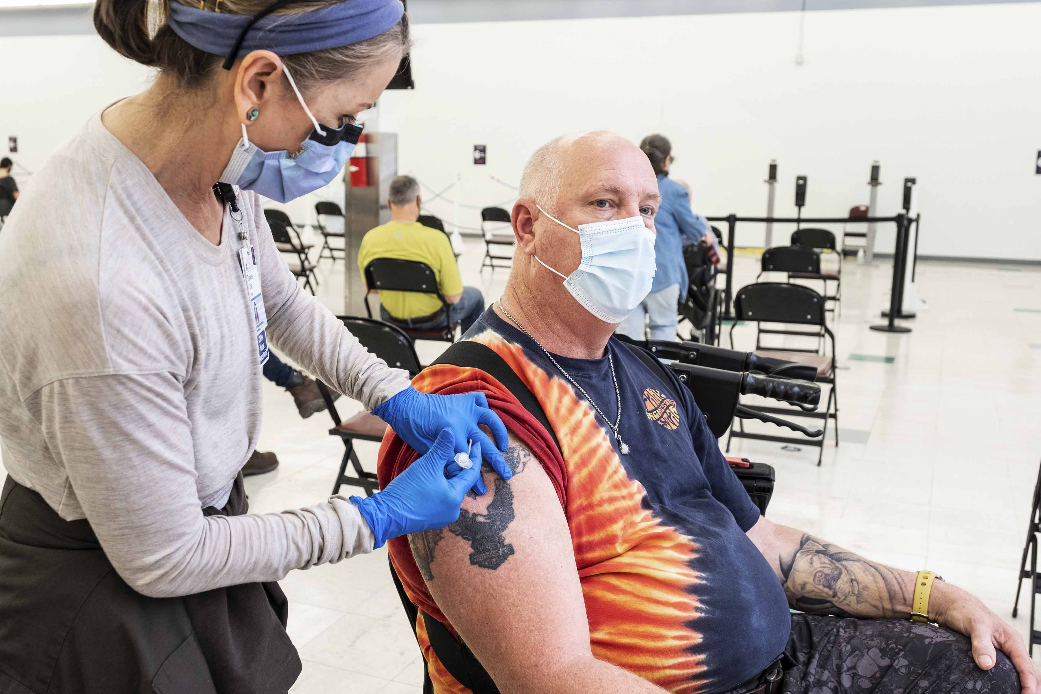 Healthcare professional giving a patient an injection