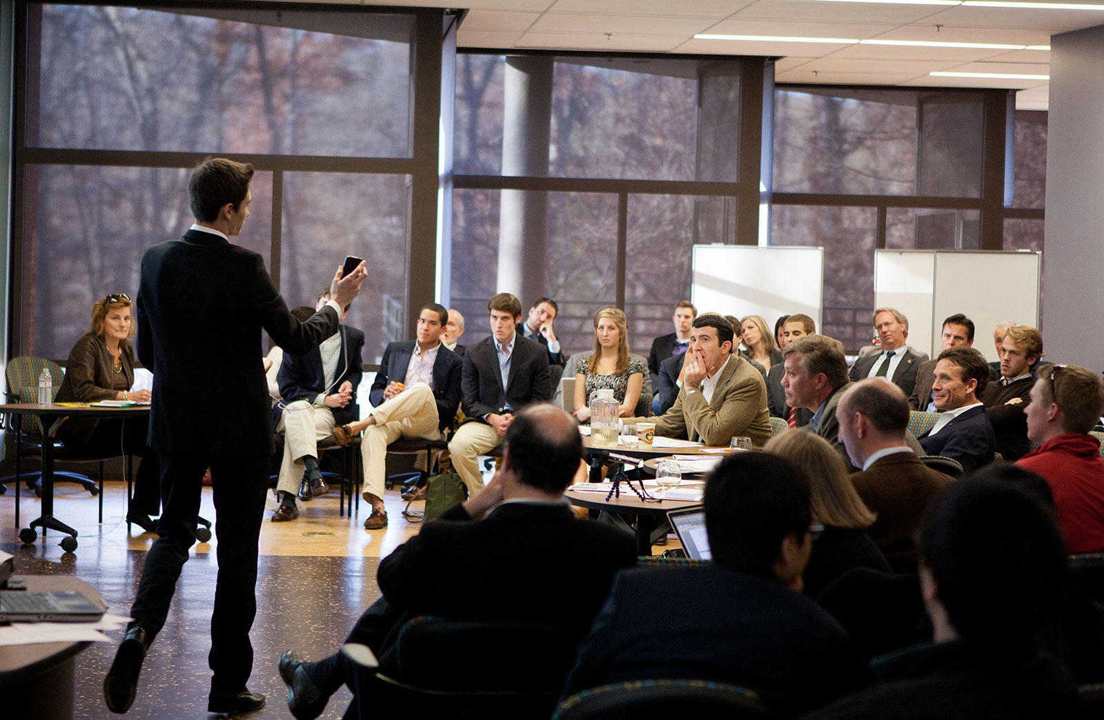 Joseph M. Linzon  presenting during a competition to an audience and judges