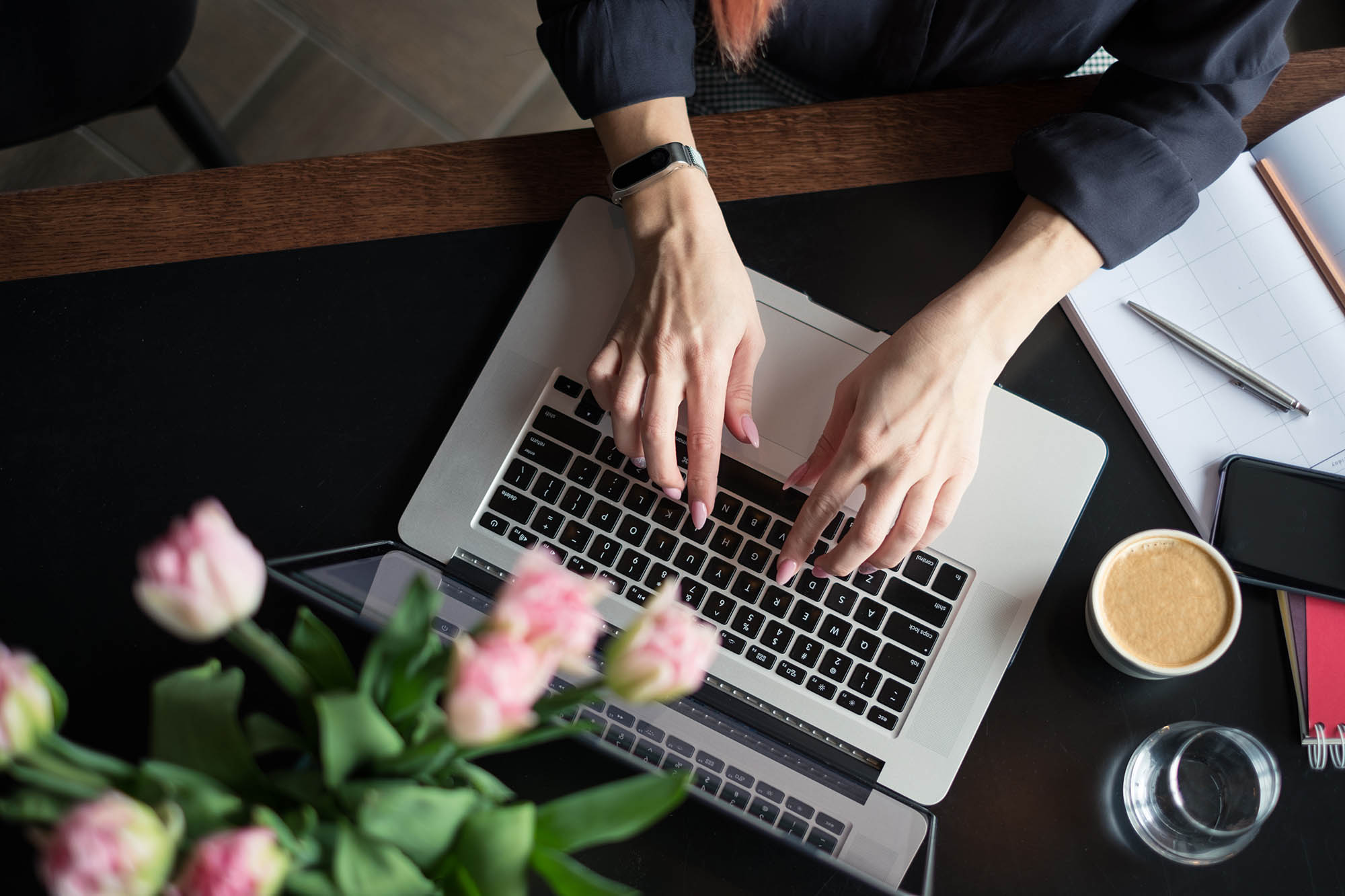 Person typing on a laptop