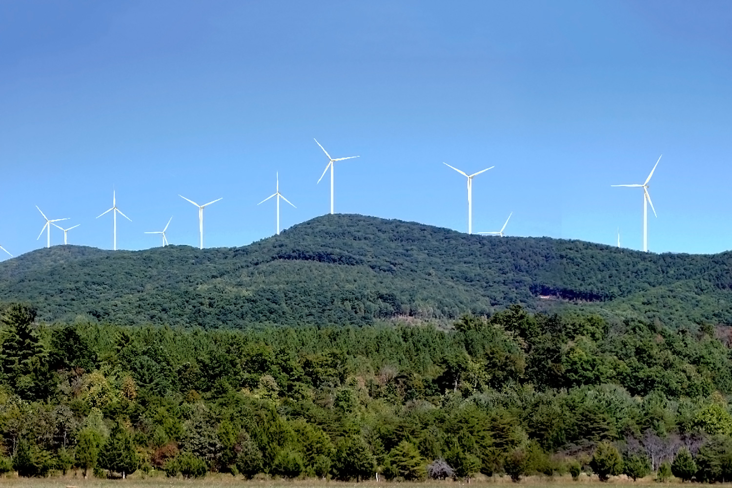 wind turbines on the top of a mountain