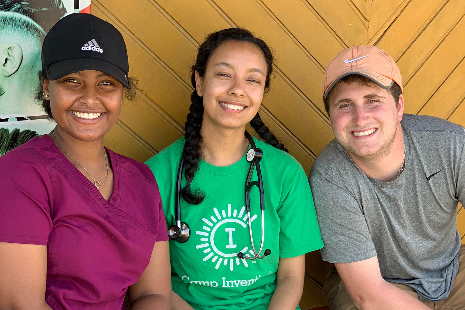 Students sit together smiling