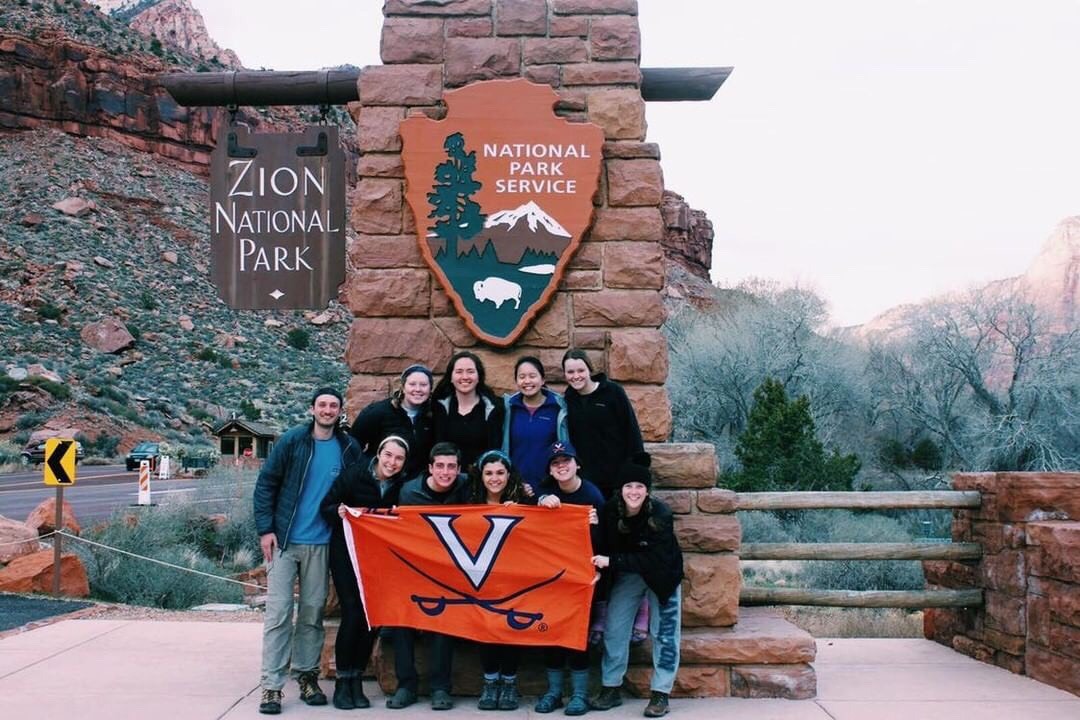 Group of students holding a UVA flag at Zion National Park