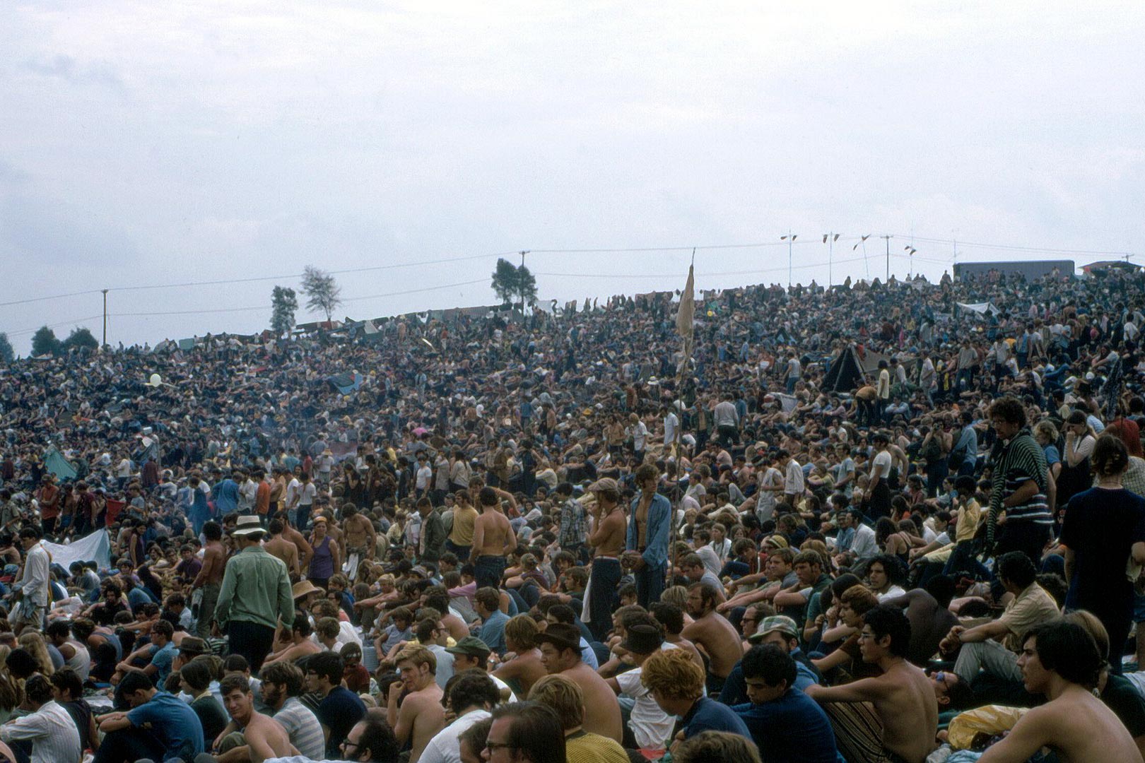 Crowd of people at Woodstock on the back field