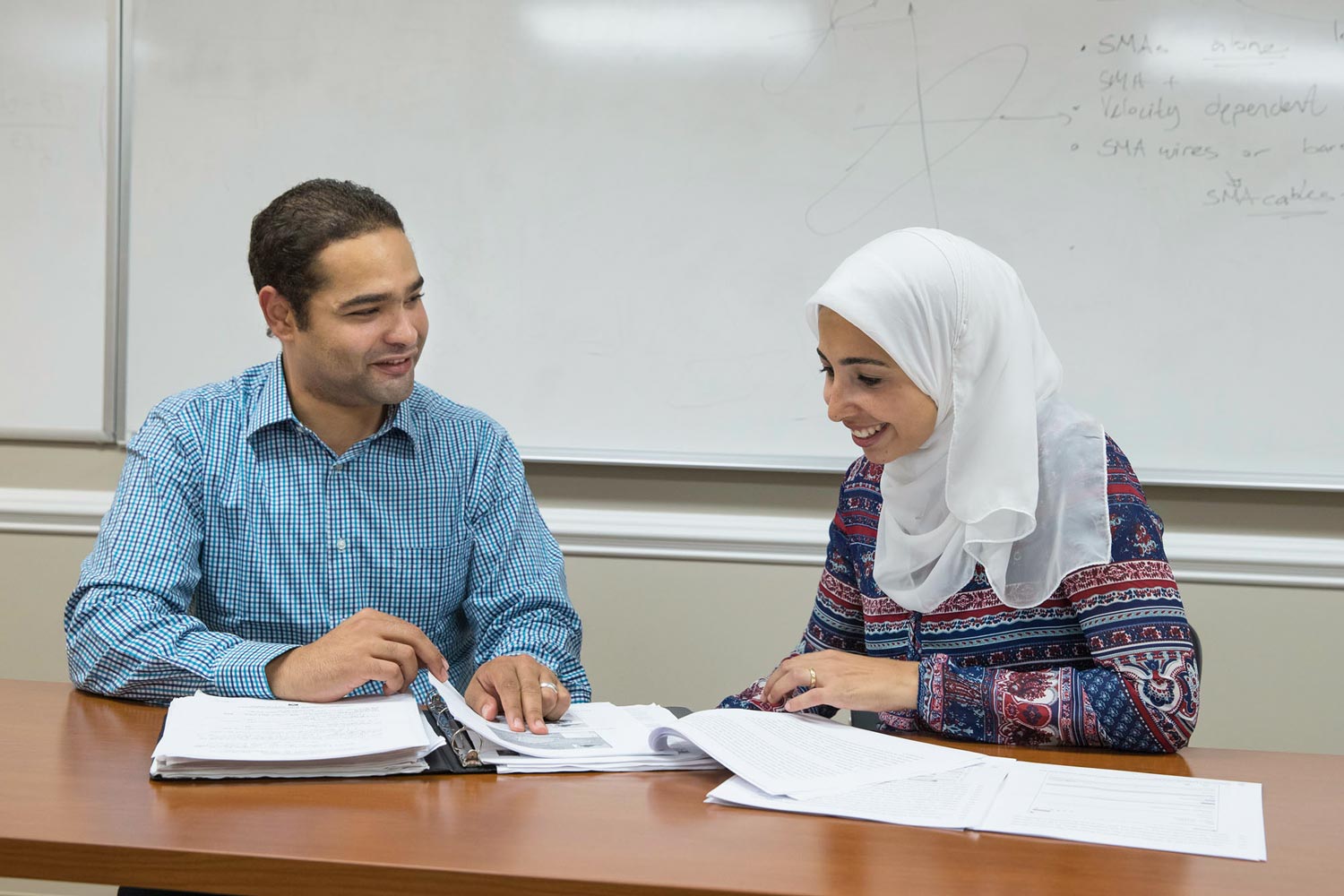 Mohamed Morsy and Bakinam Tarik Essawy working together at a table