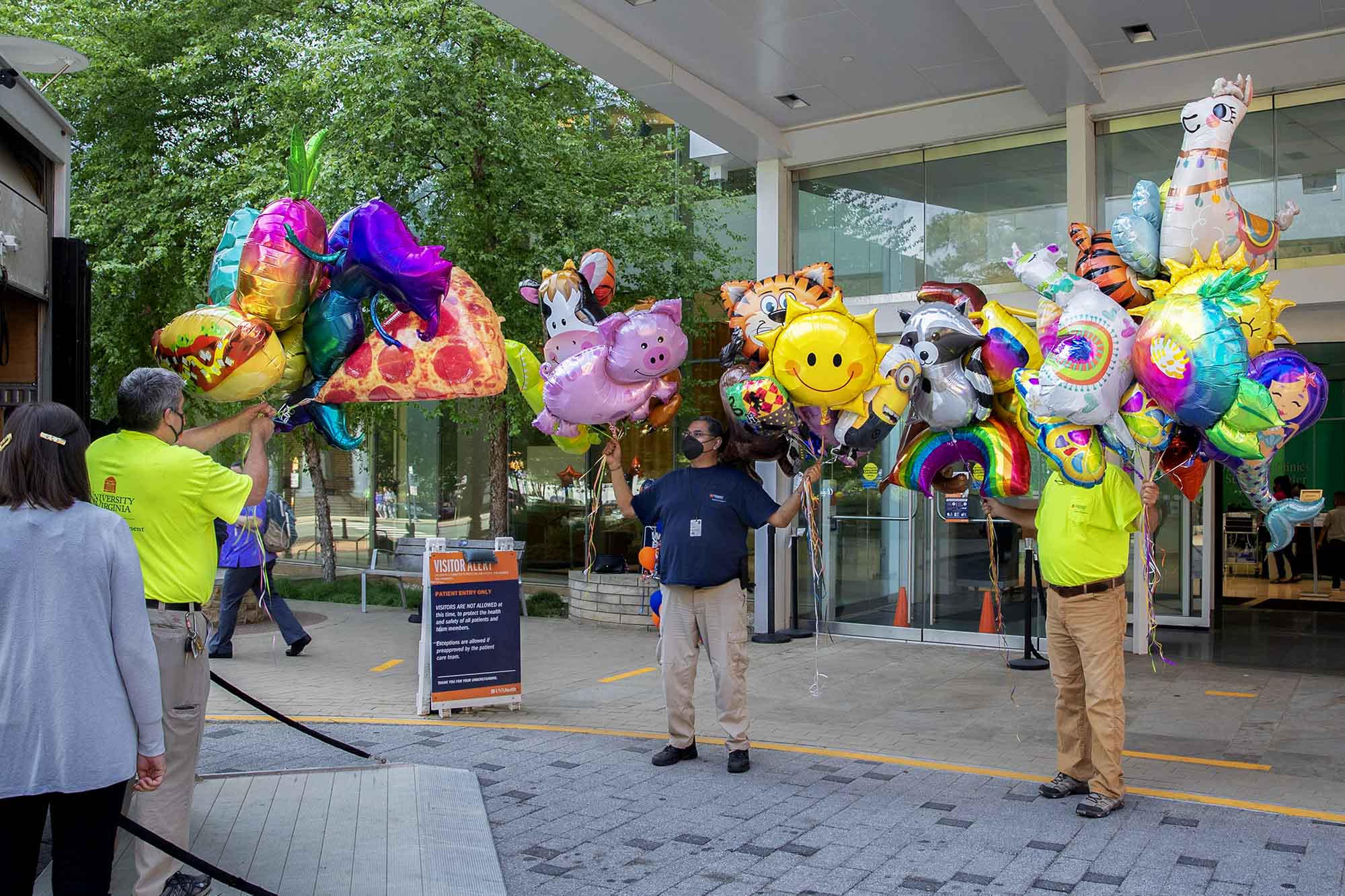 UVA staff members collecting balloons to donate to the UVA childrens hospital
