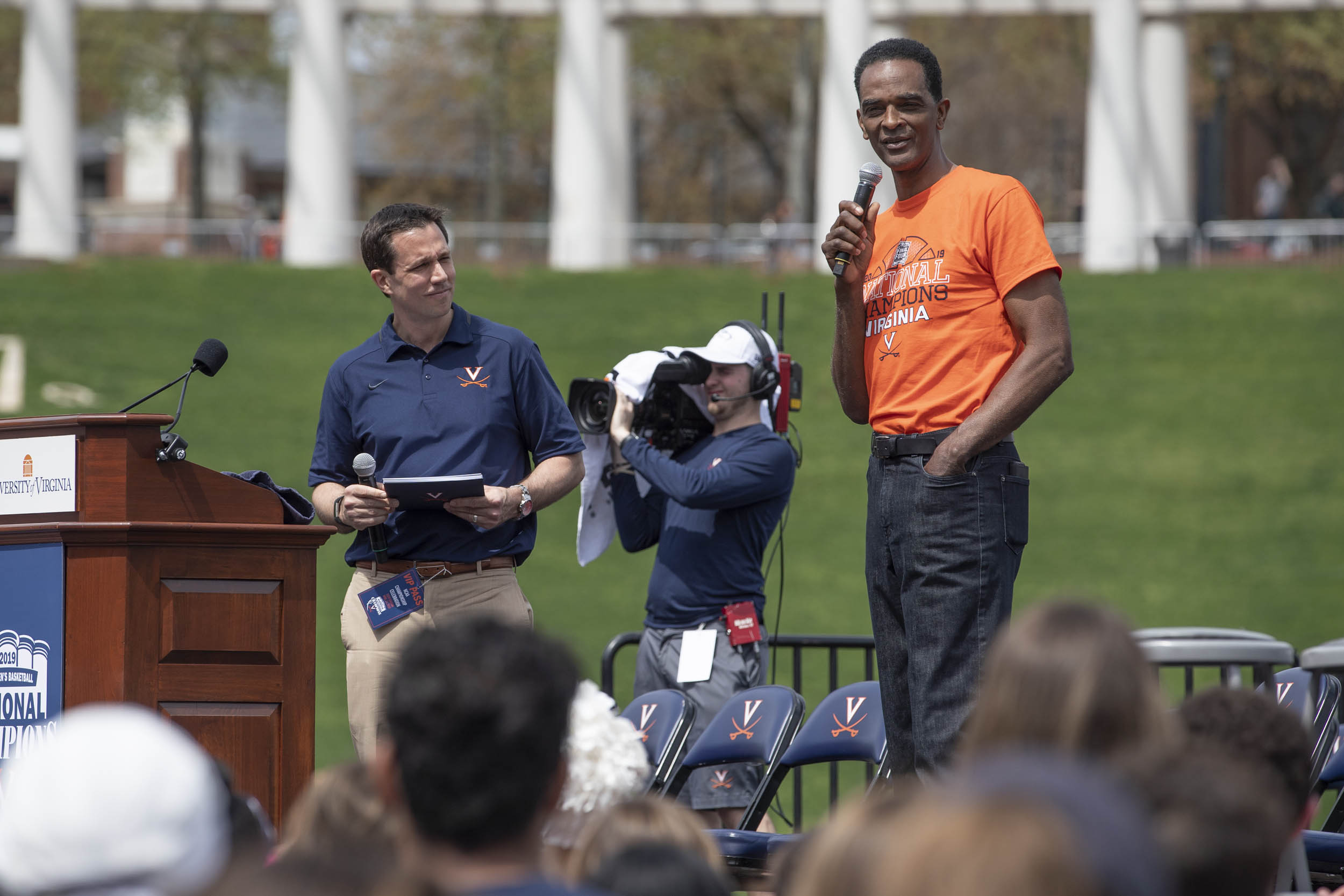 Ralph Sampson stands on stage talking to crowd