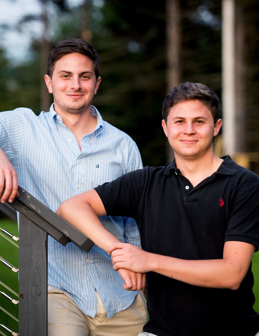 Jack Ross, right, and his older brother, Michael, standing on steps