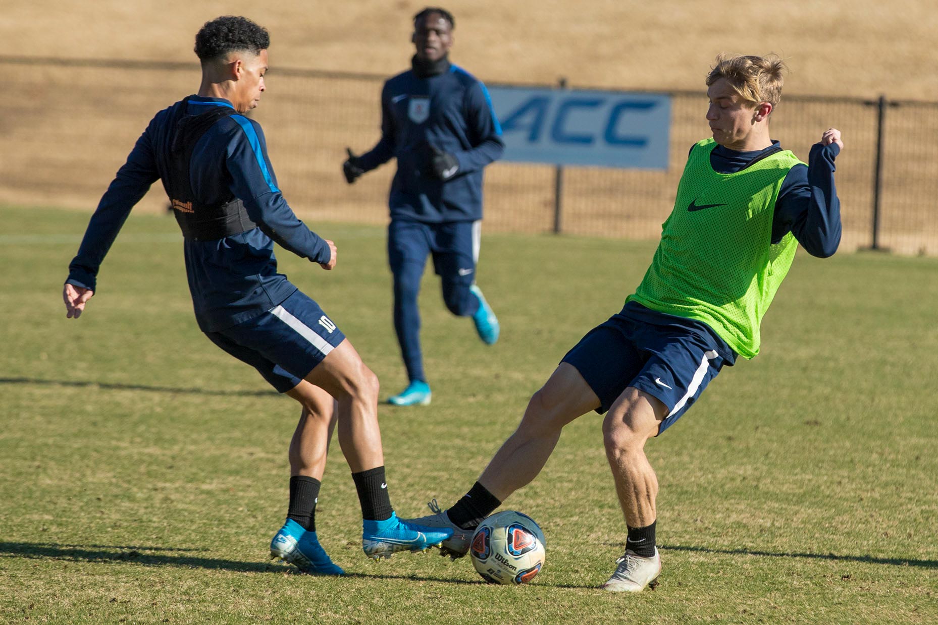 Bradley protecting the ball while playing soccer during a game