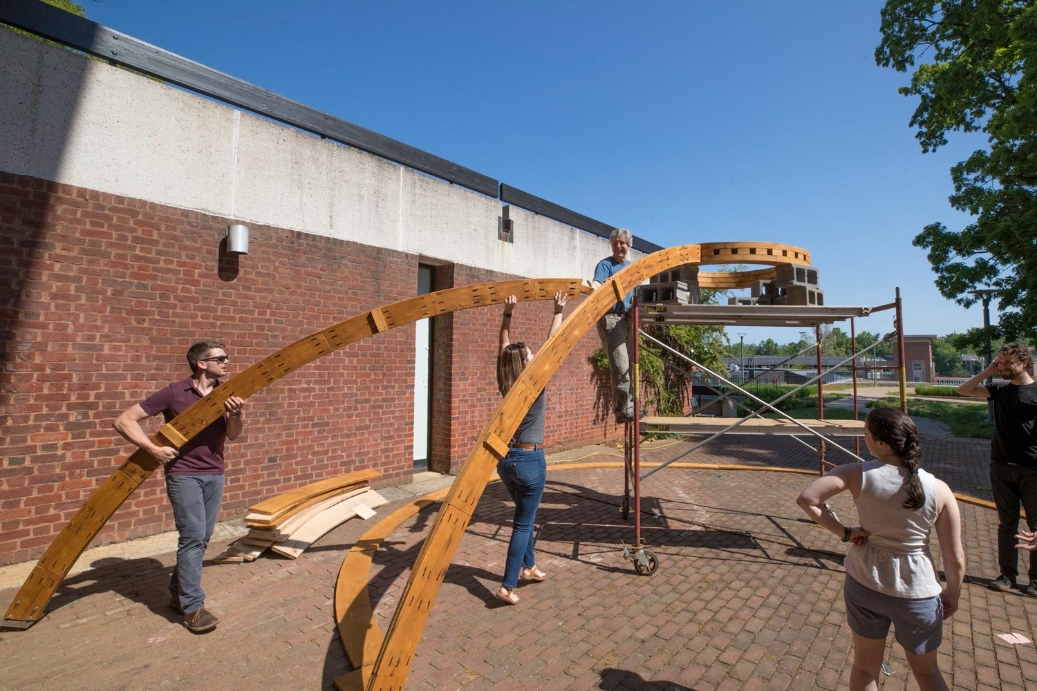 Hays, far left, and his students assembled the model outside of Campbell Hall throughout the semester. 