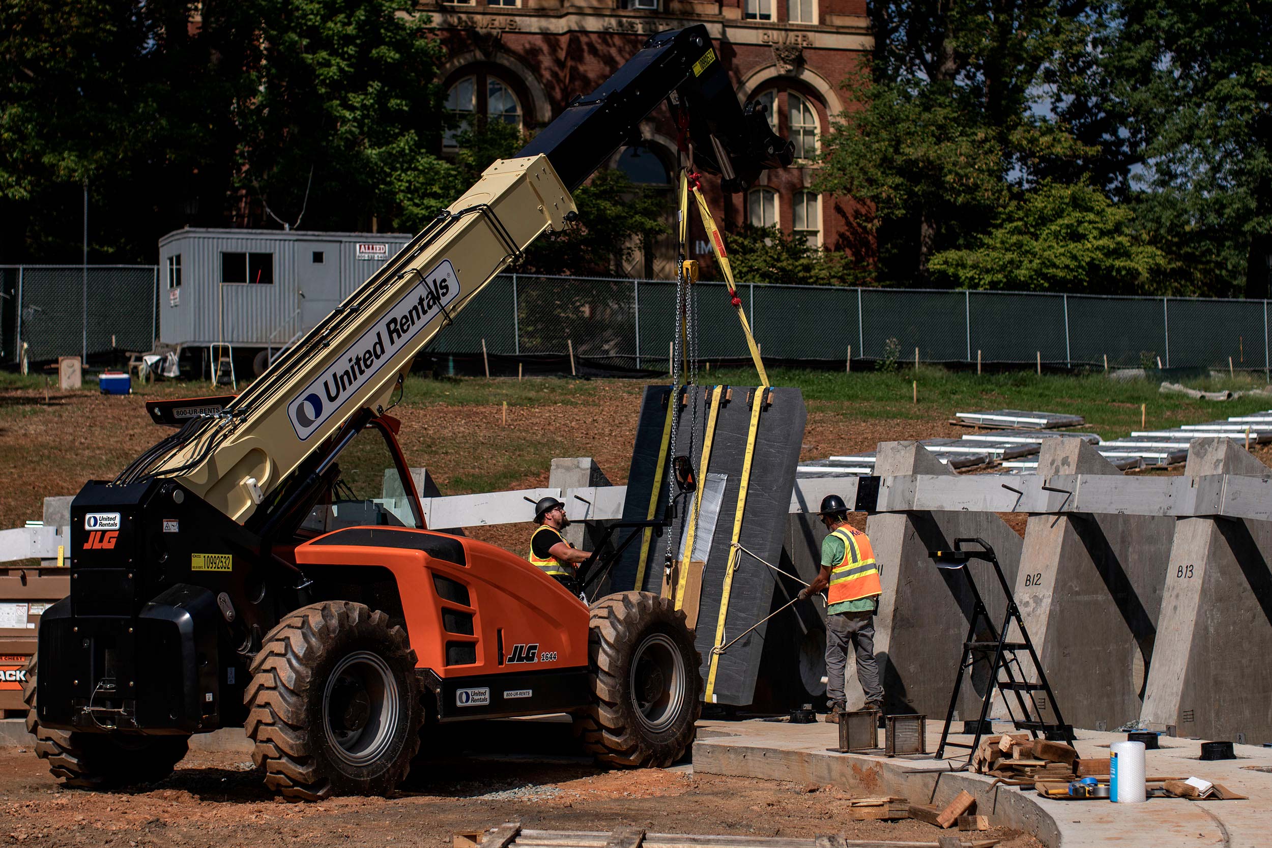 construction workers working on building the memorial of enslaved laborers