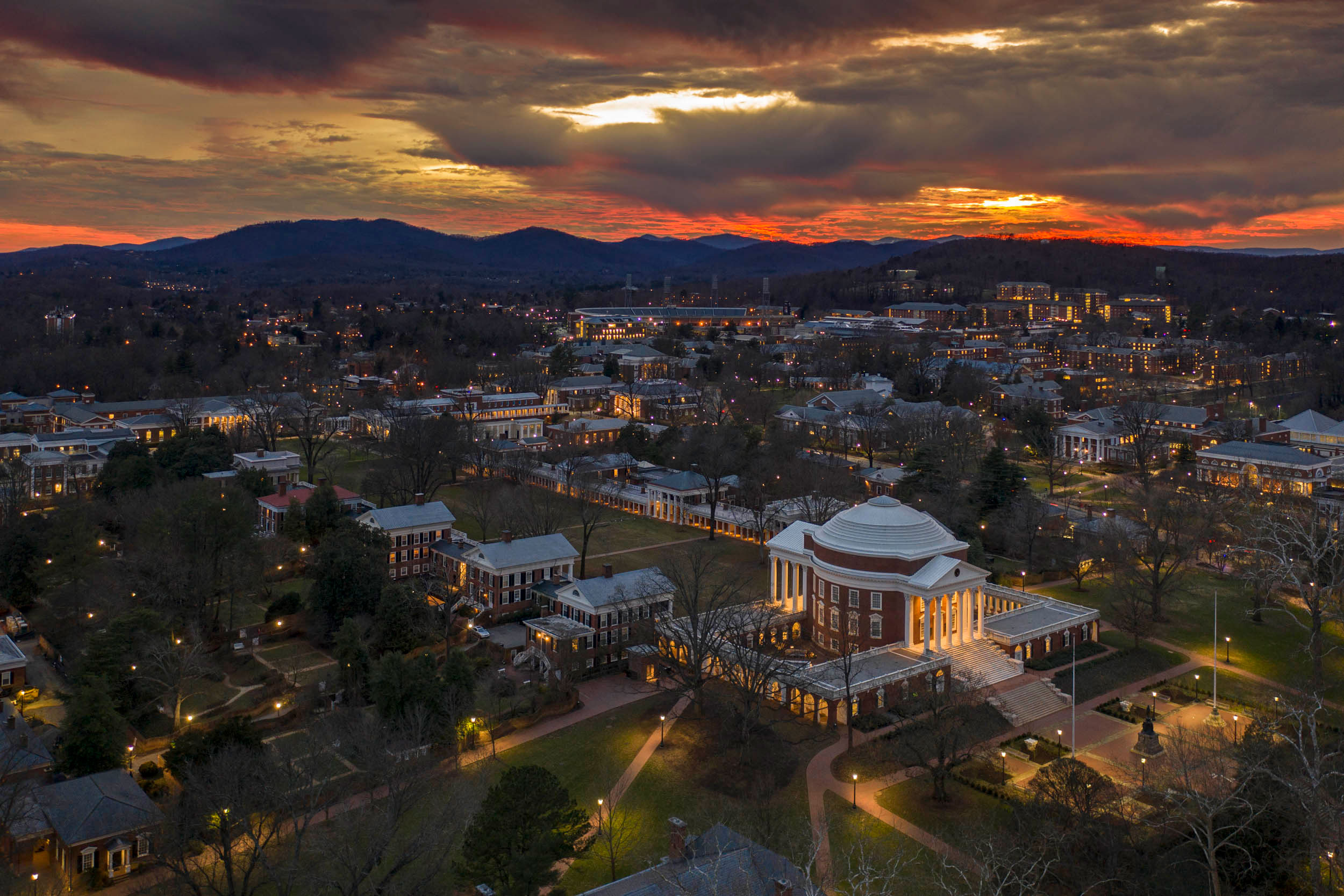 Aerial view of the Rotunda an Charlottesville at dusk with lights on