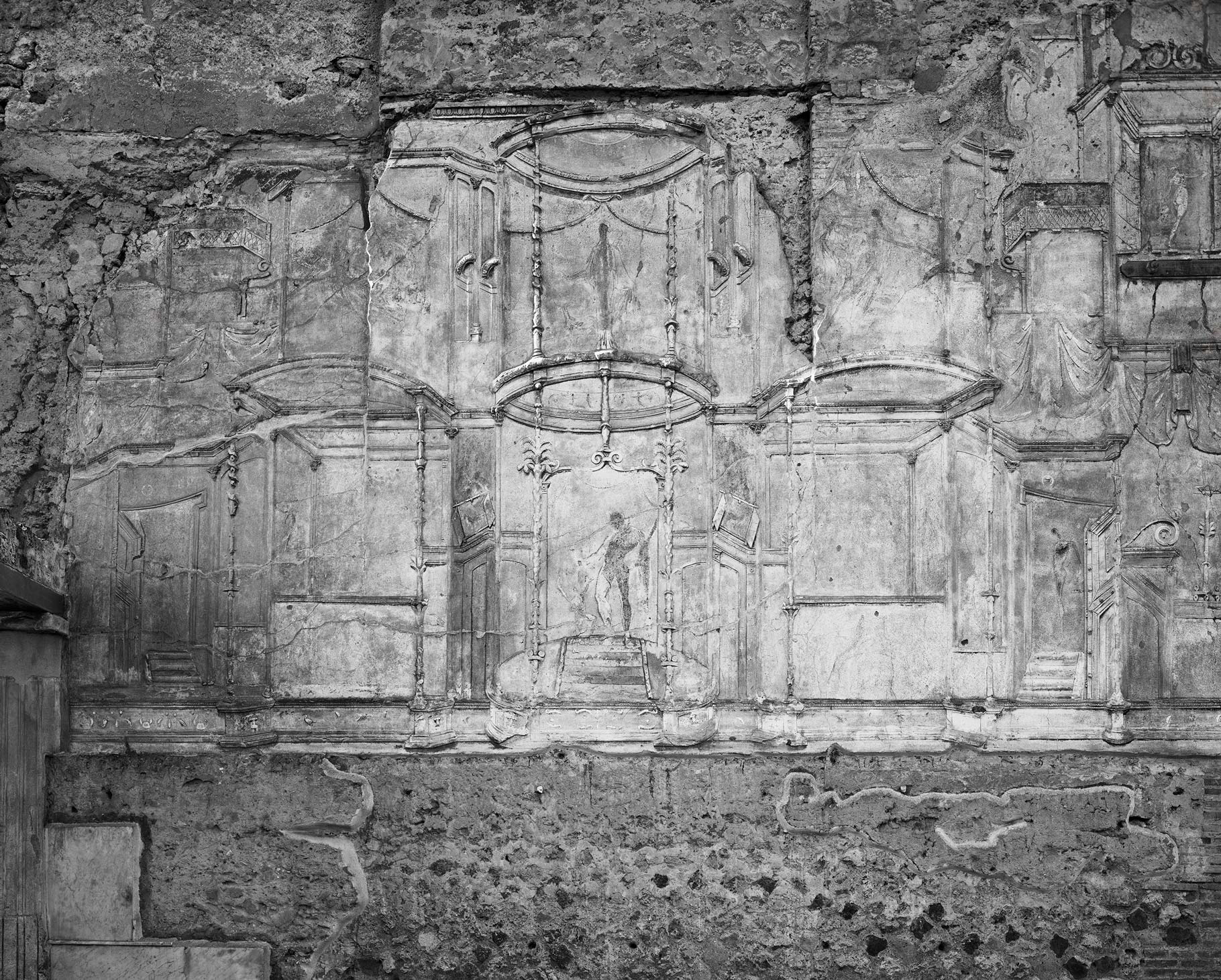 Carved wall in pompeii, black and white image