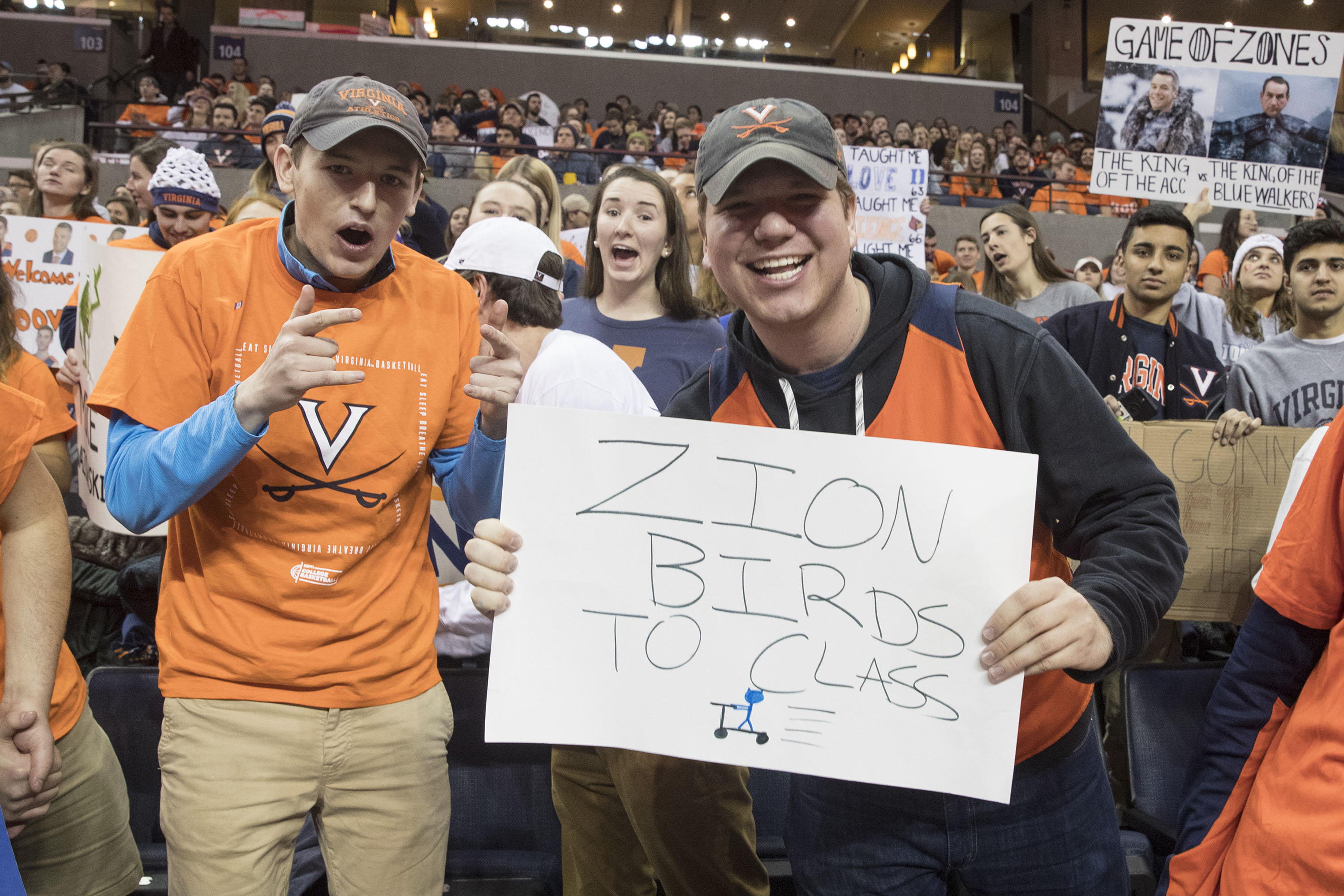 Fan holds a sign that reads Zion Birds to class