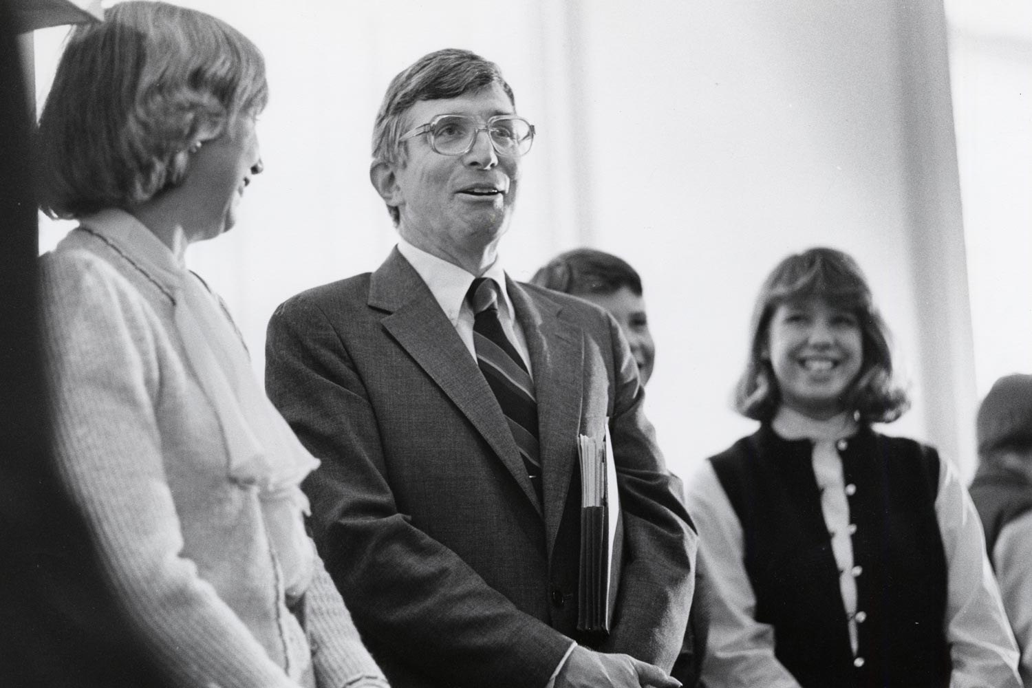 O'Neil stands talking to a small group after being inaugurated as President