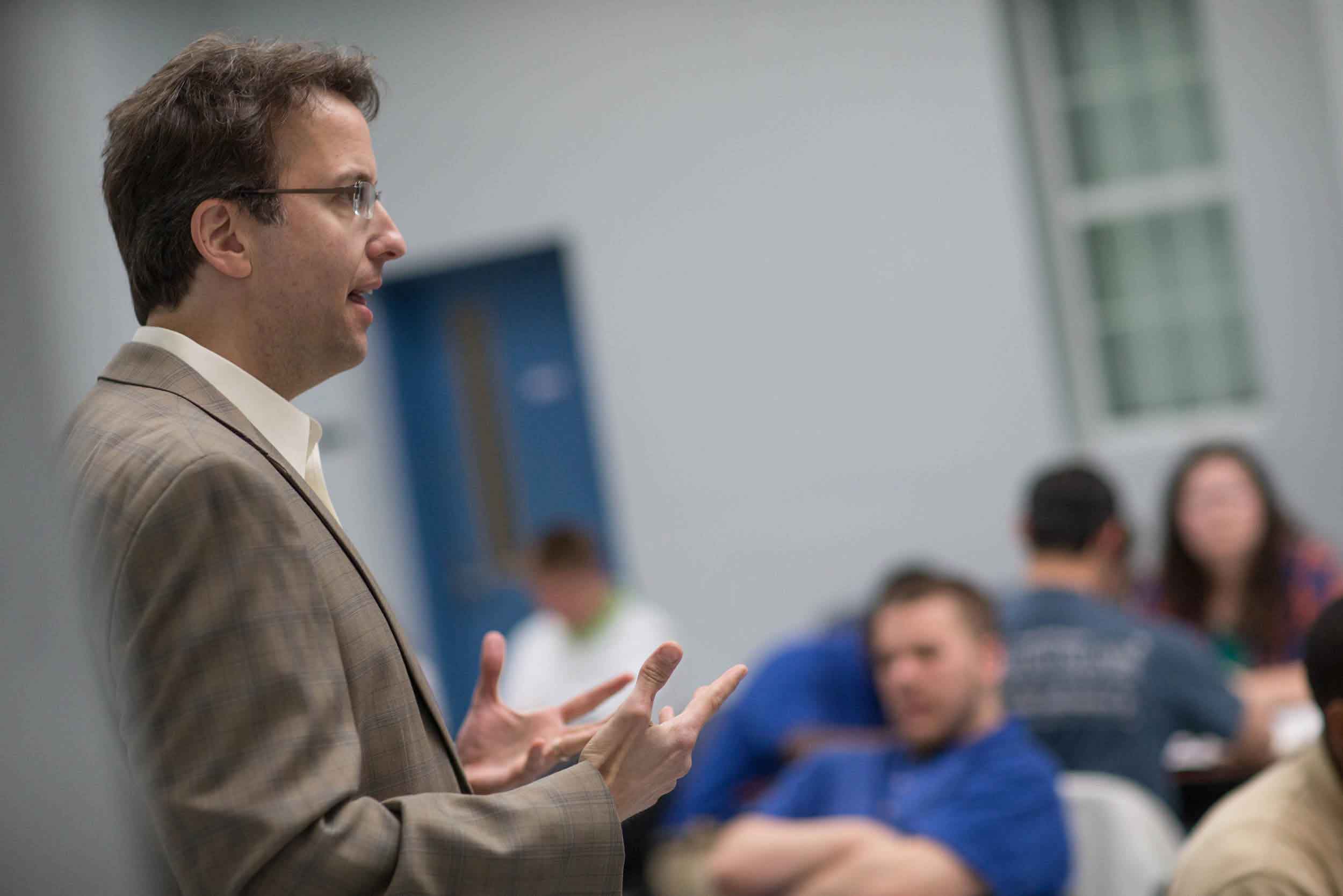 Kaufman addresses students during a class in March.