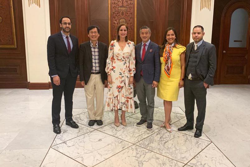 Syed, far left, with colleagues stand together for a picture