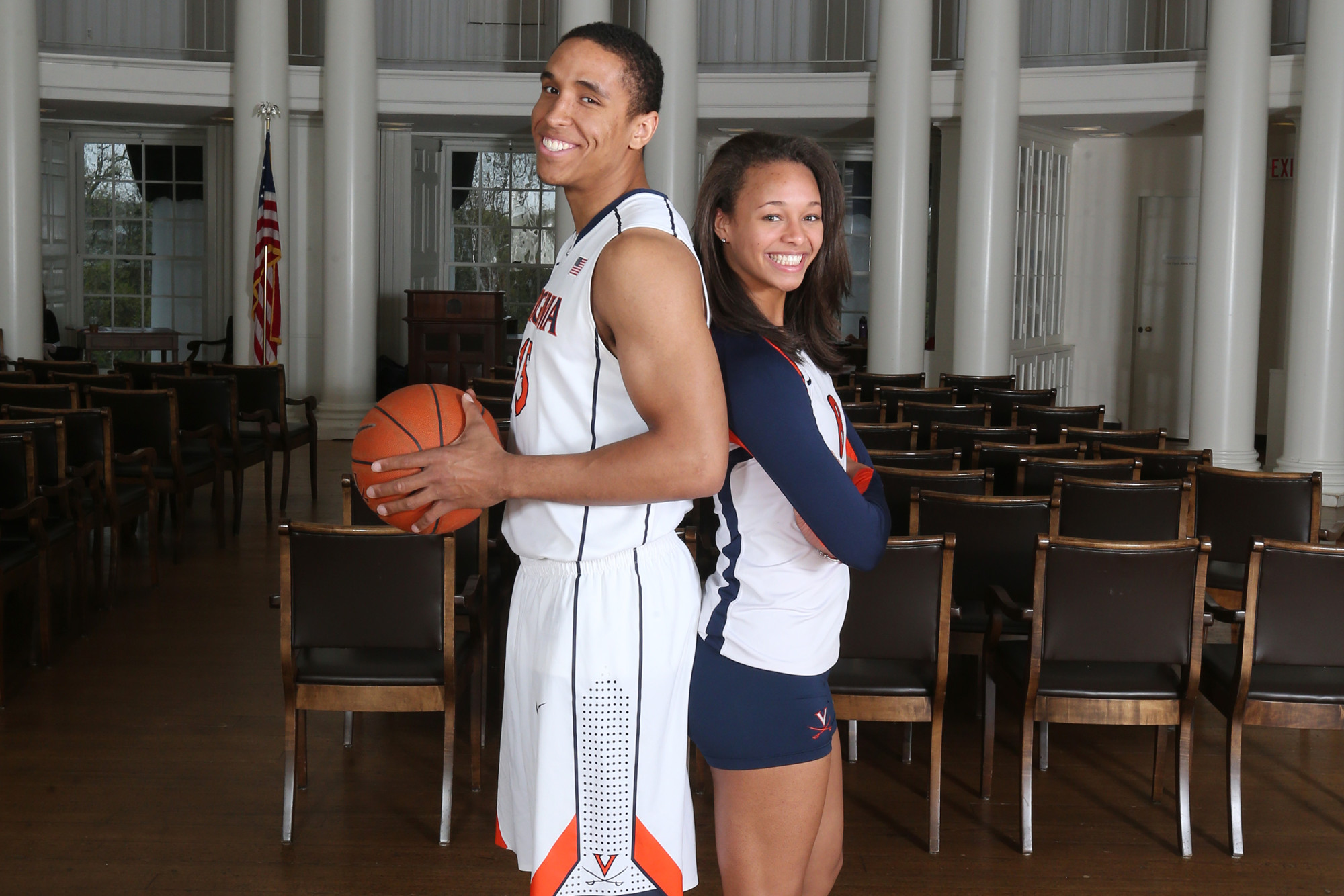 Brogdon and Janowski stand back to back smiling at the camera