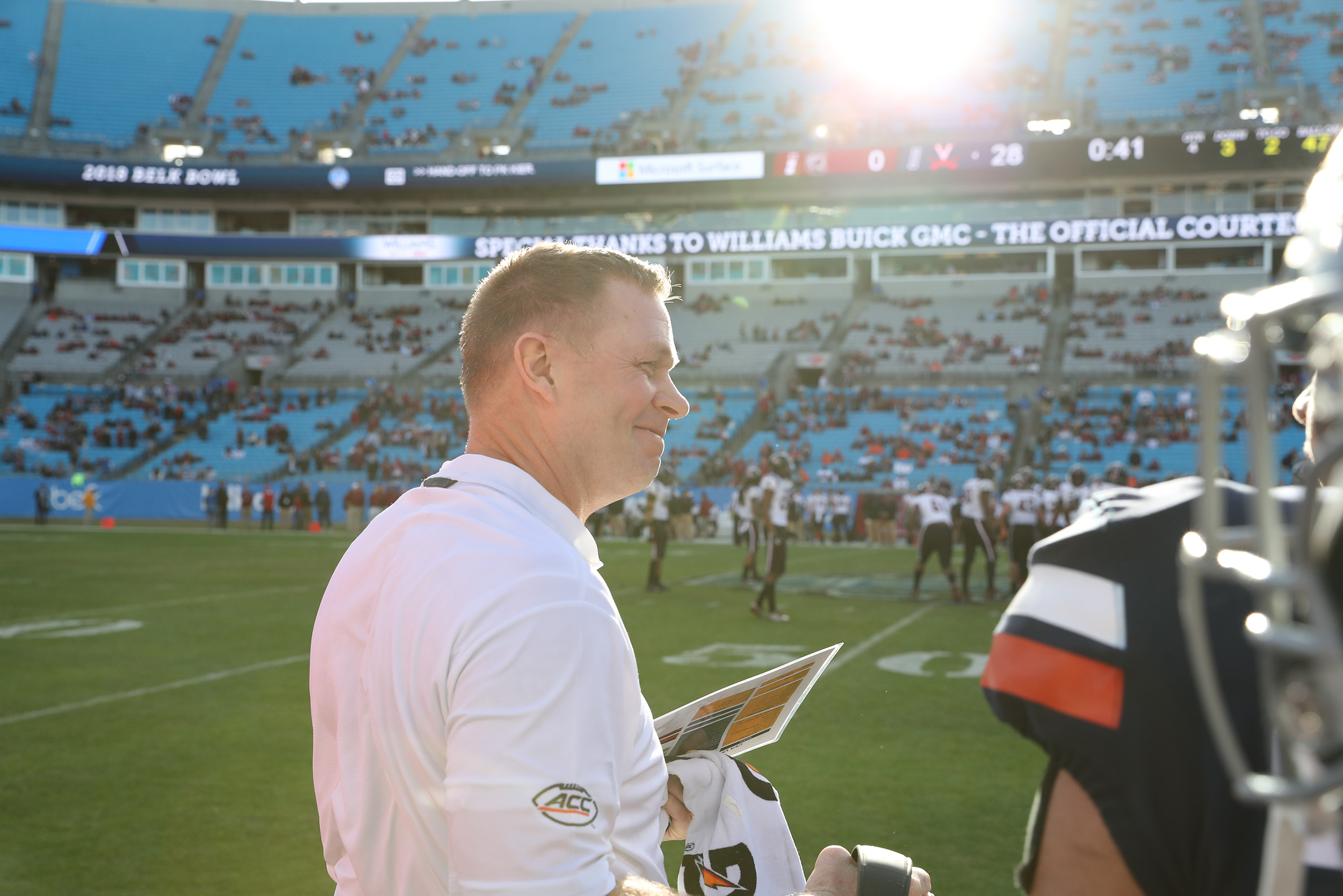 Bronco Mendenhall smiling on the sideline