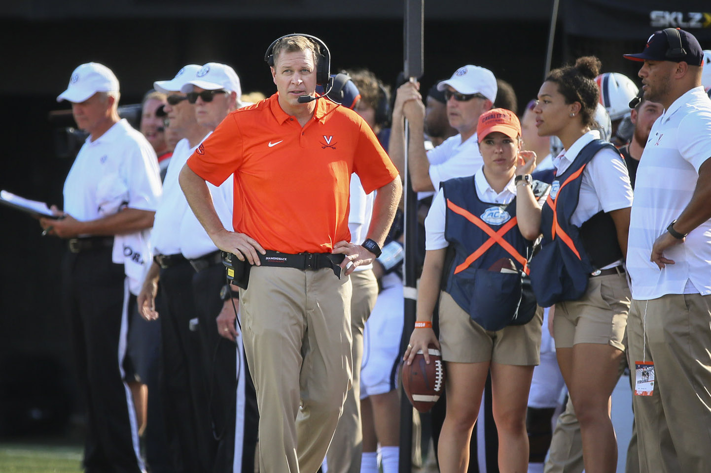 Coach Mendenhall walking the sideline during a football game