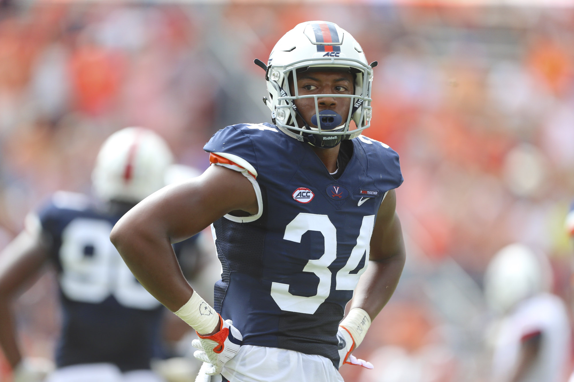 Bryce Hall stands on football field during a game