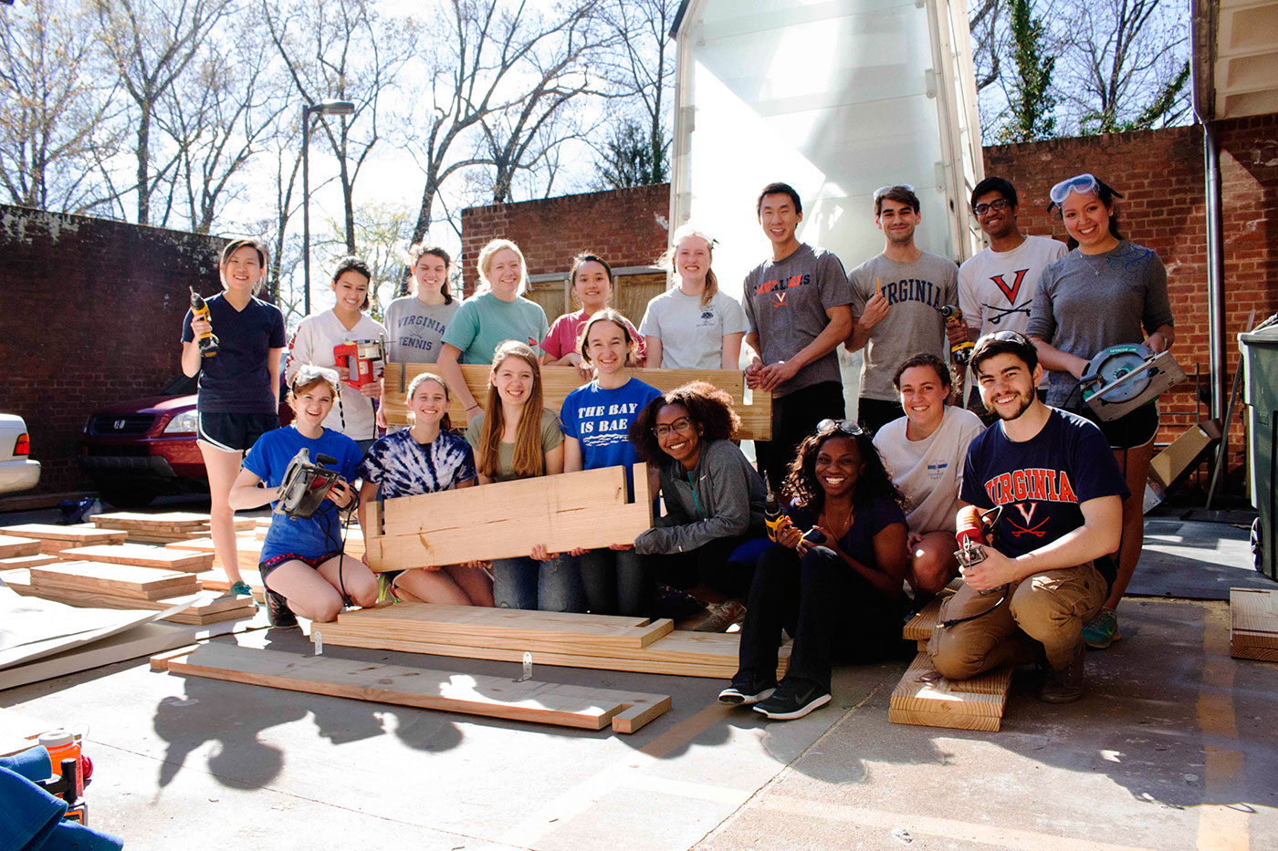 Growing for CHANGE volunteers and executive board members work together at the woodshop in the School of Architecture to build the gardens. (Photo courtesy of Shantell Bingham).