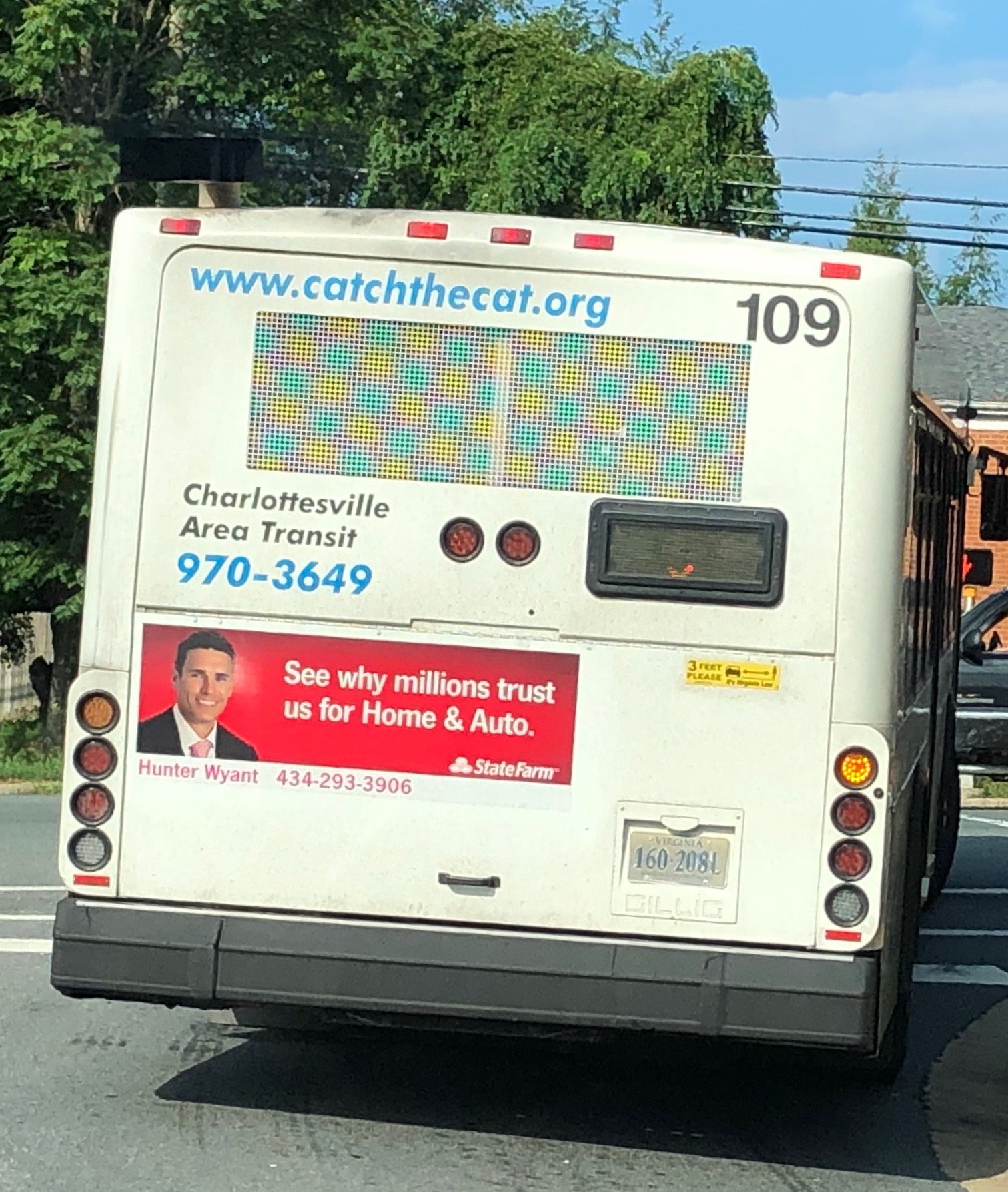 Wyant’s image on the back of a bus as part of a State Farm ad