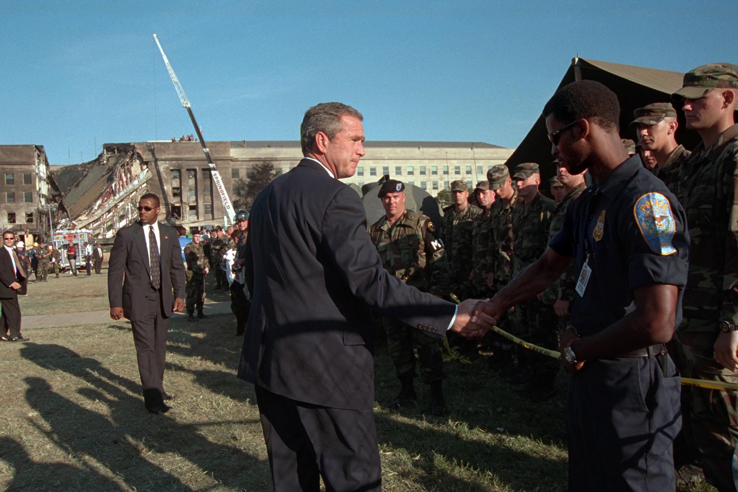 President George W. bush shaking hands with first responders at the Pentagon