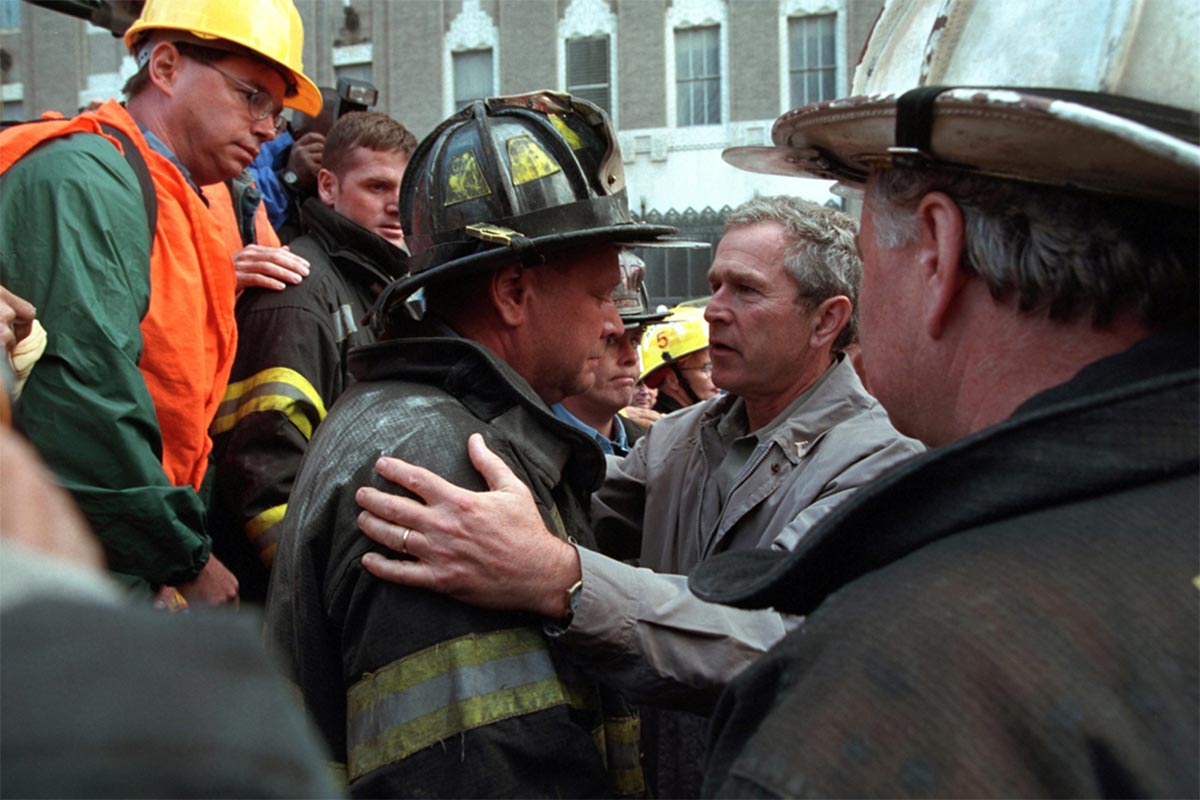 President George W. Bush thanks a firefighter at Ground Zero 