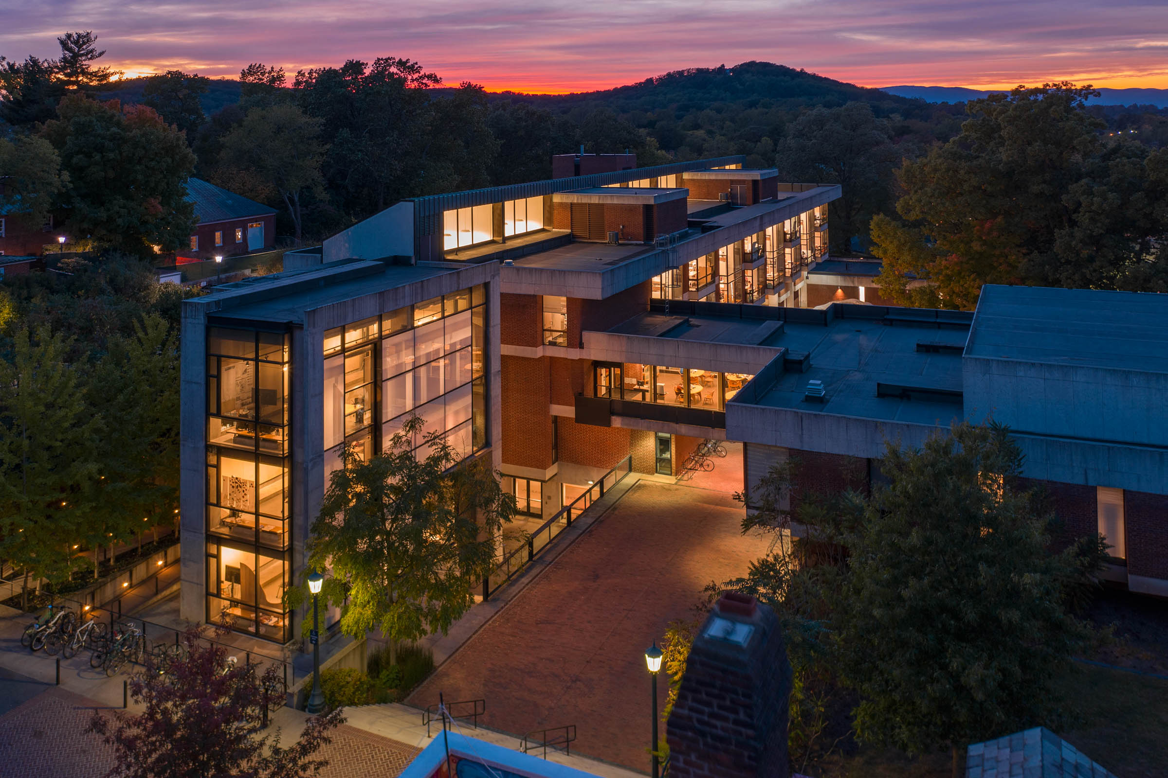 Arial view of Campbell hall lit up at night
