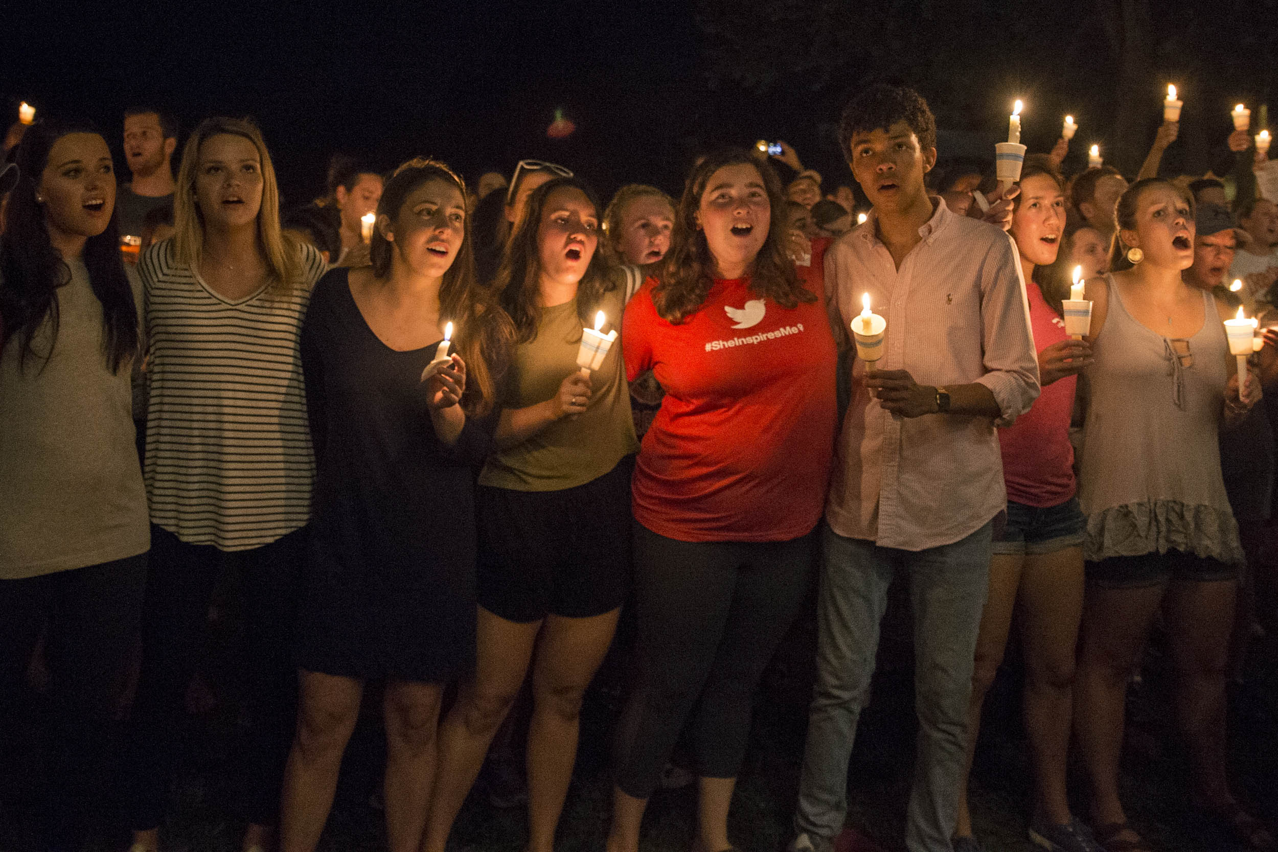 Students sing.