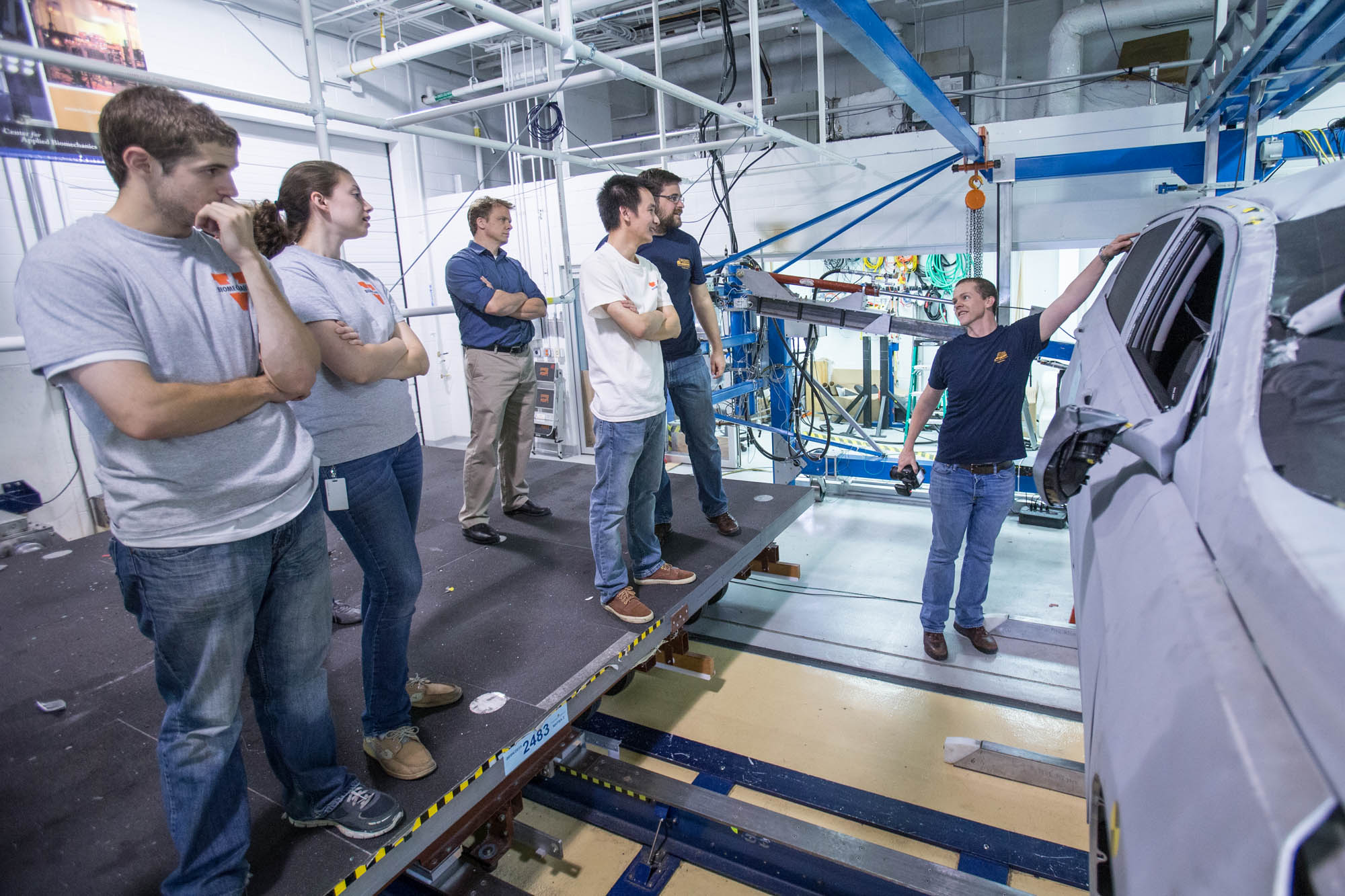 Mechanical engineering professor Jason Kerrigan discusses a crash test result with students.