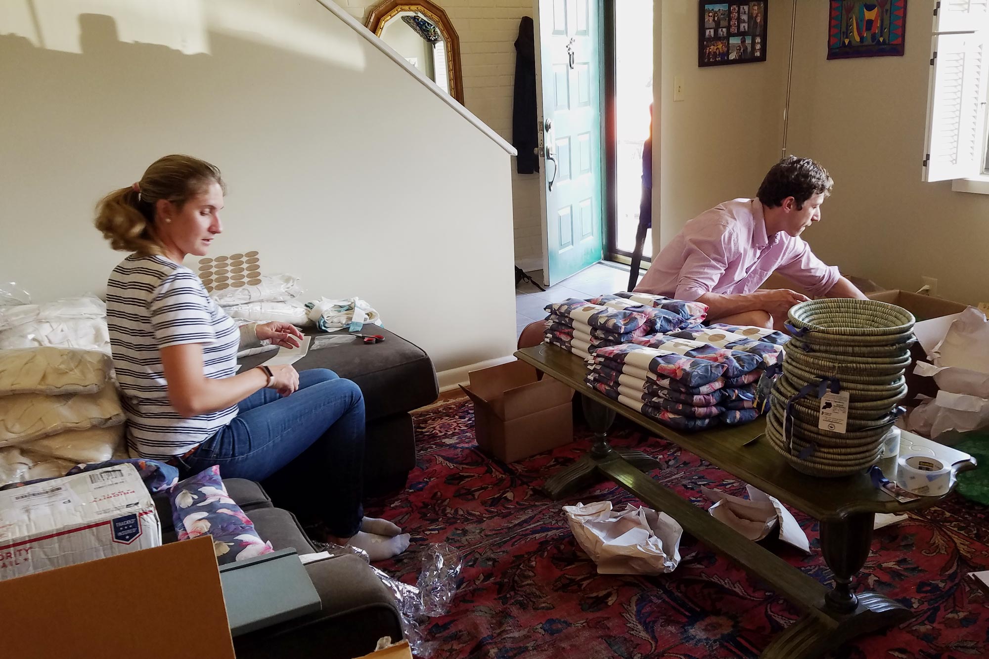 Katie White, left, and Gabe Legendy, right help pack baskets for mothers day