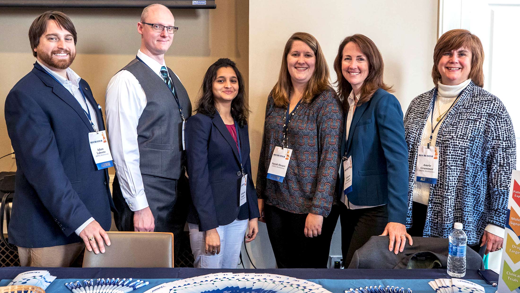 Grammer, far right, with her team from AMPEL BioSolutions, including from left to right, UVA alumnus Adam Labonte, Nick Geraci, Prathyusha Bachali, alumna Sarah Heuer and Rebecca Bender. 