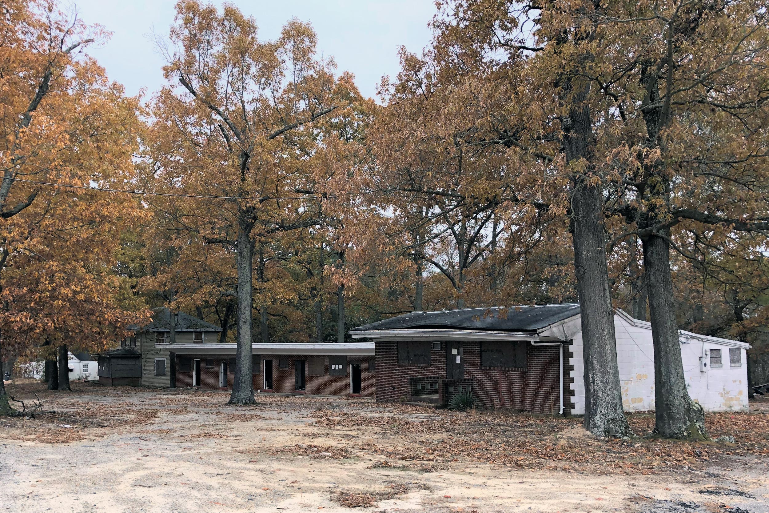 Brick Buildings of Colbrook Inn surrounded by trees