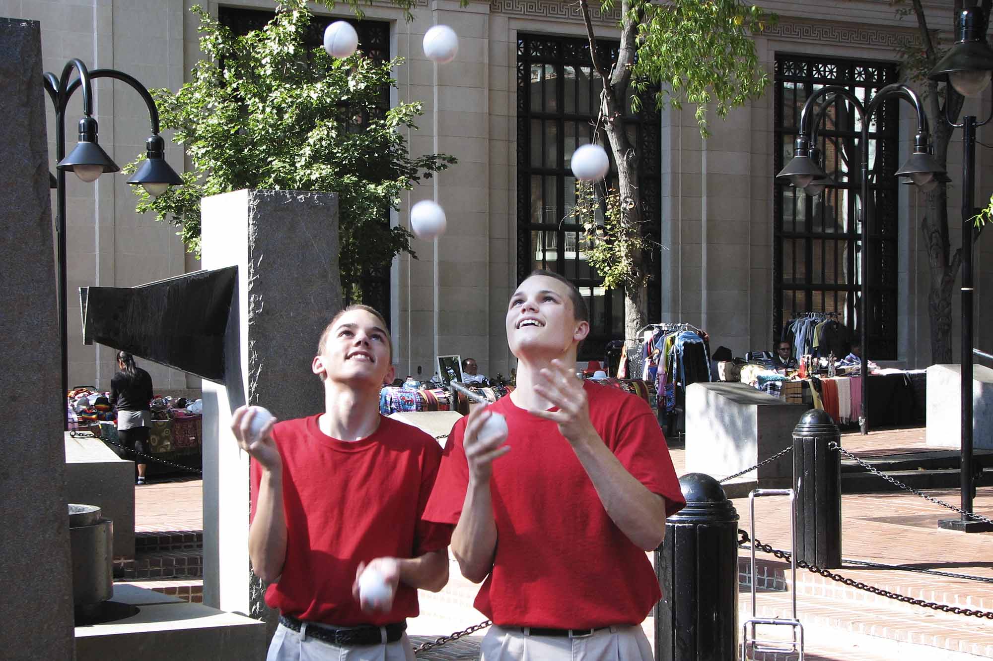 Brothers Andrew and Chris Hodge juggling on the Charlottesville downtown mall