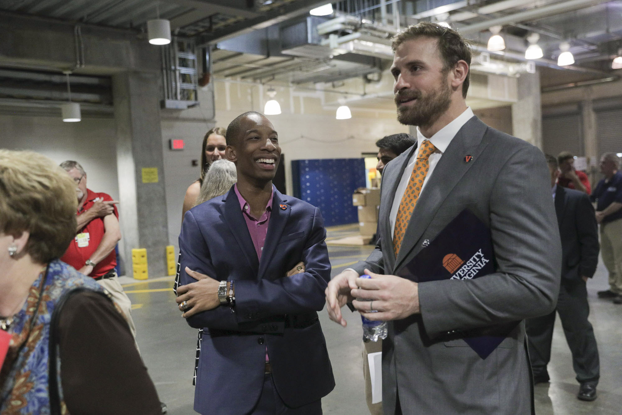 Chris Long, right, and Malcolm Stewart, left, talk before going out onto the stage