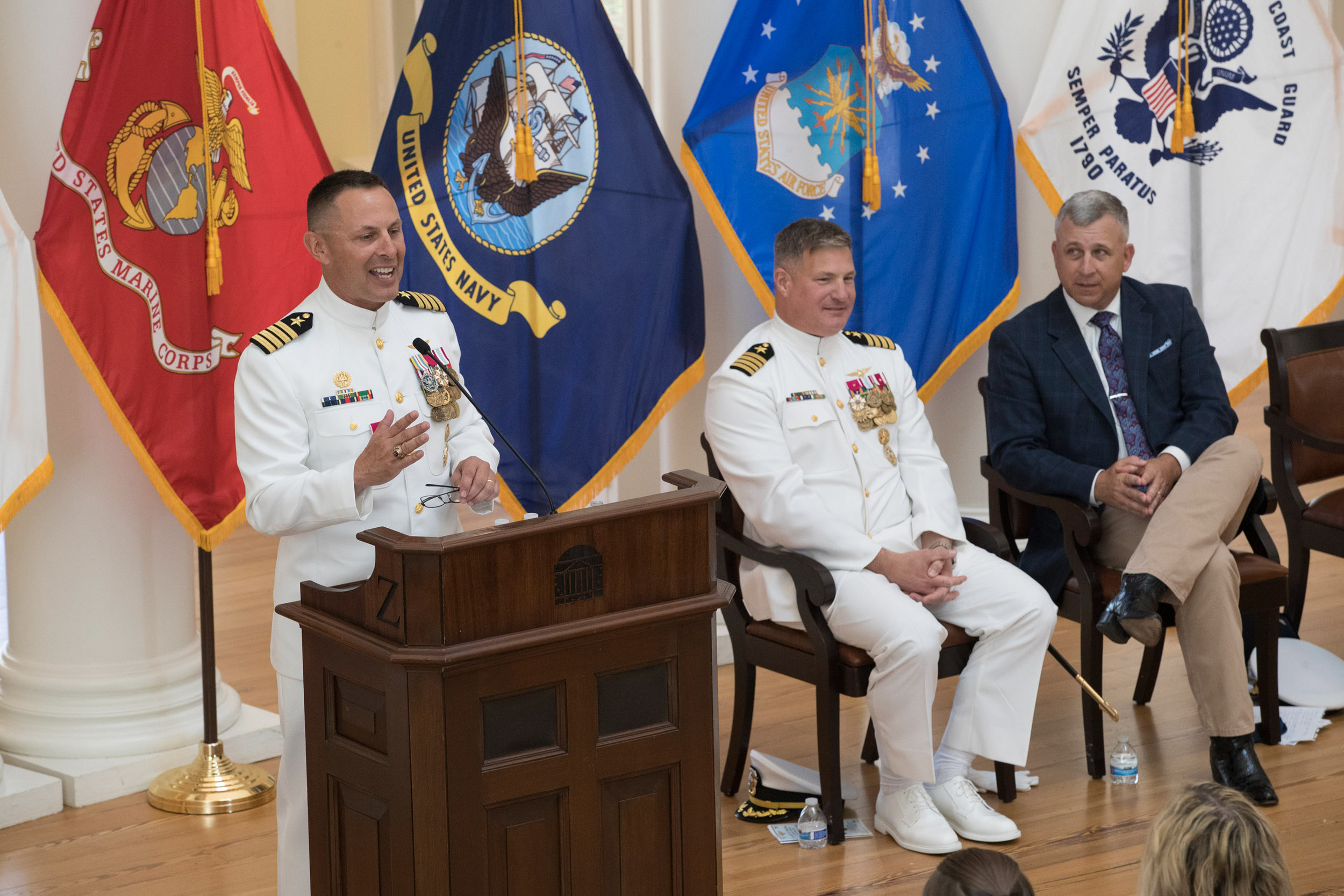 Misner, left, recounts some of his days in the U.S. Navy at his retirement ceremony in the Rotunda Dome Room.