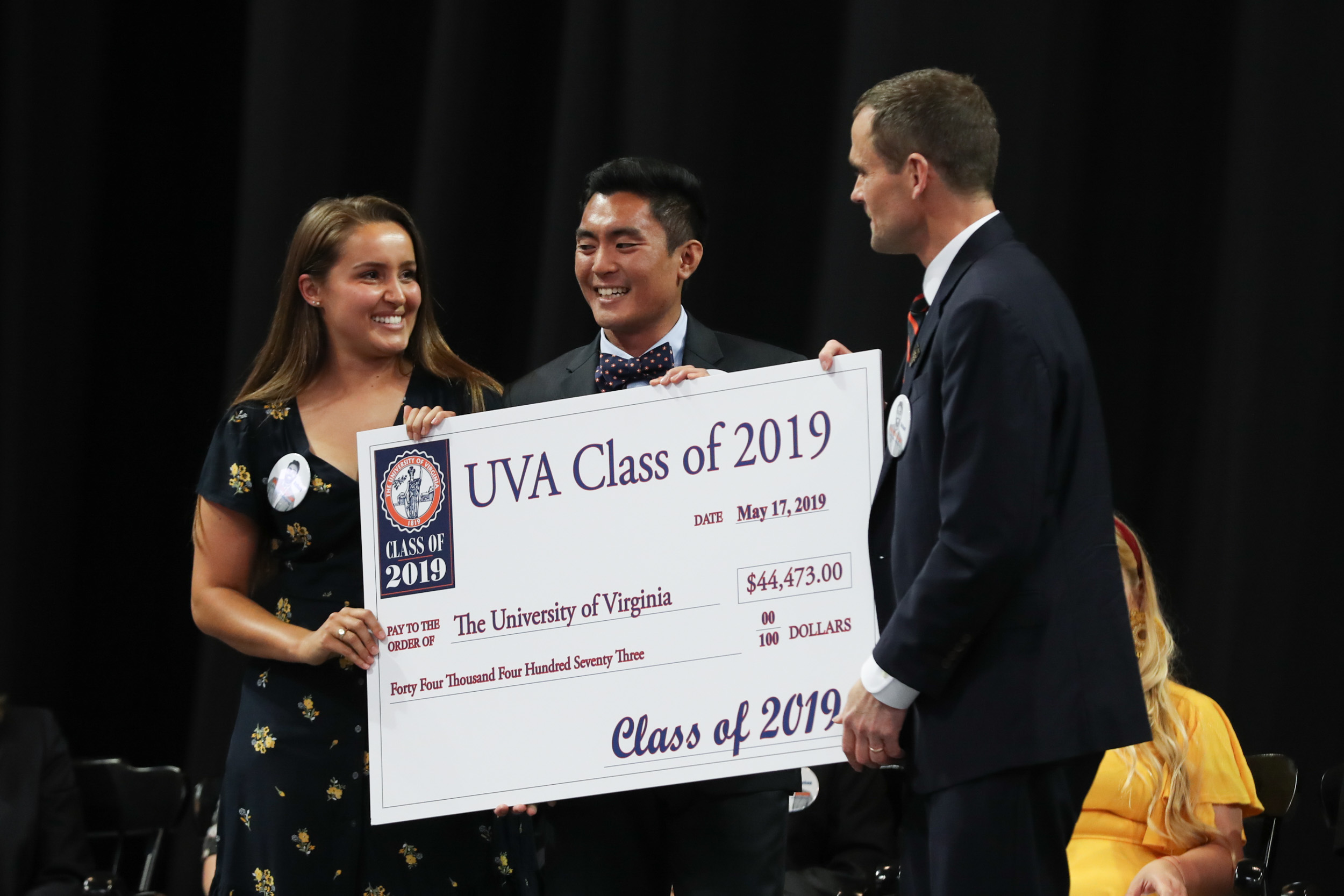 President Jim Ryan accepts a check for forty four thousand four hundred and seventy three dollars