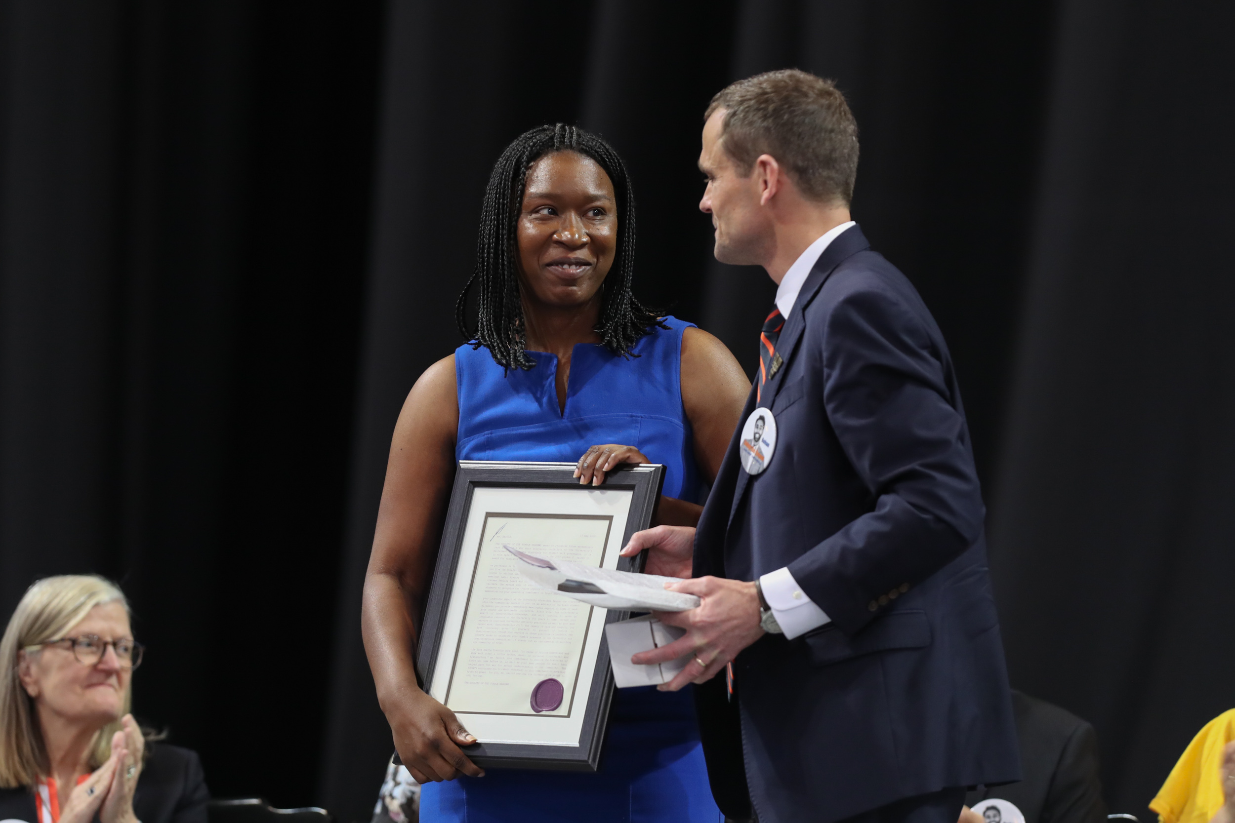 President Jim Ryan presents Claudrena N. Harold an award