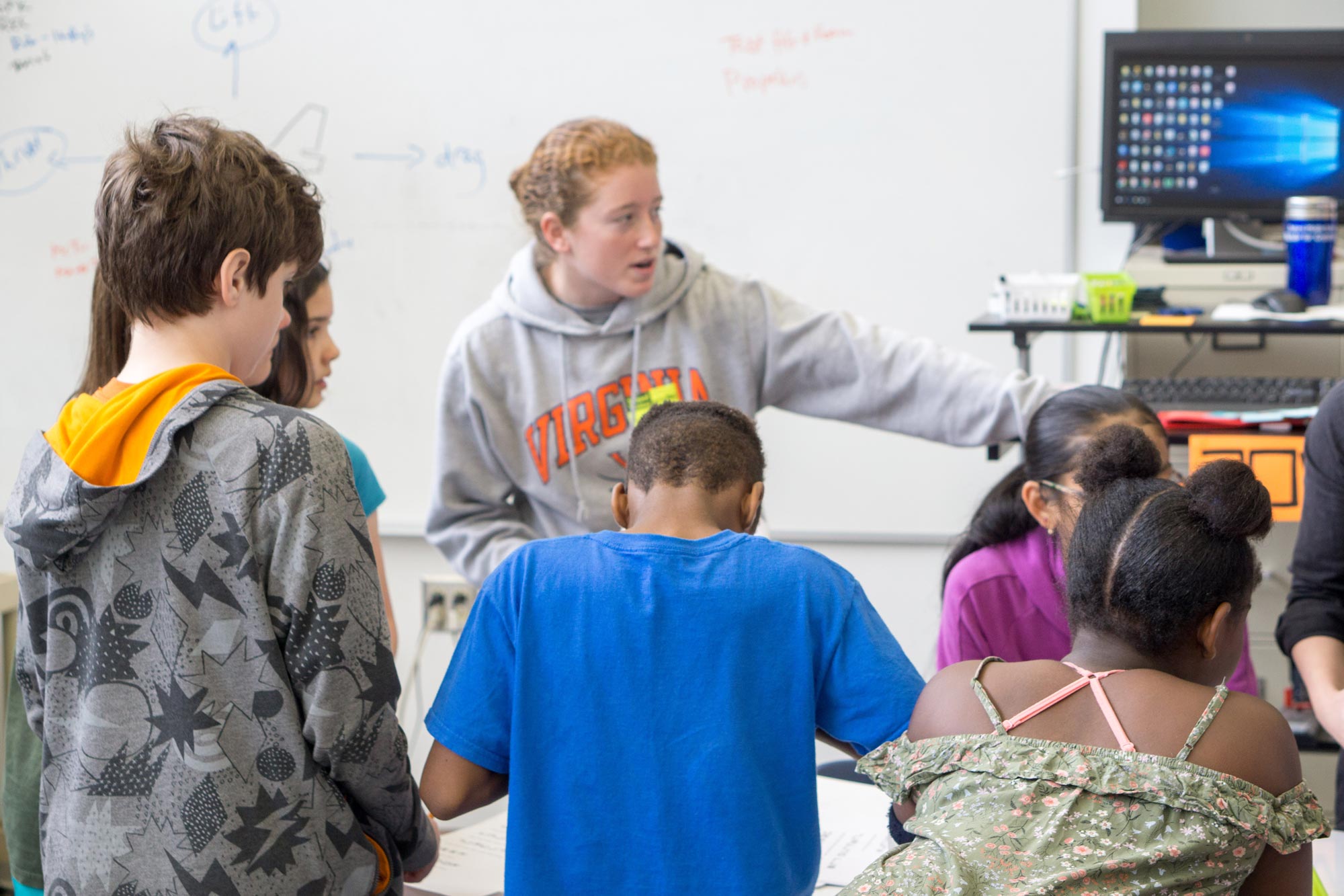 UVA student working with youth in a classroom