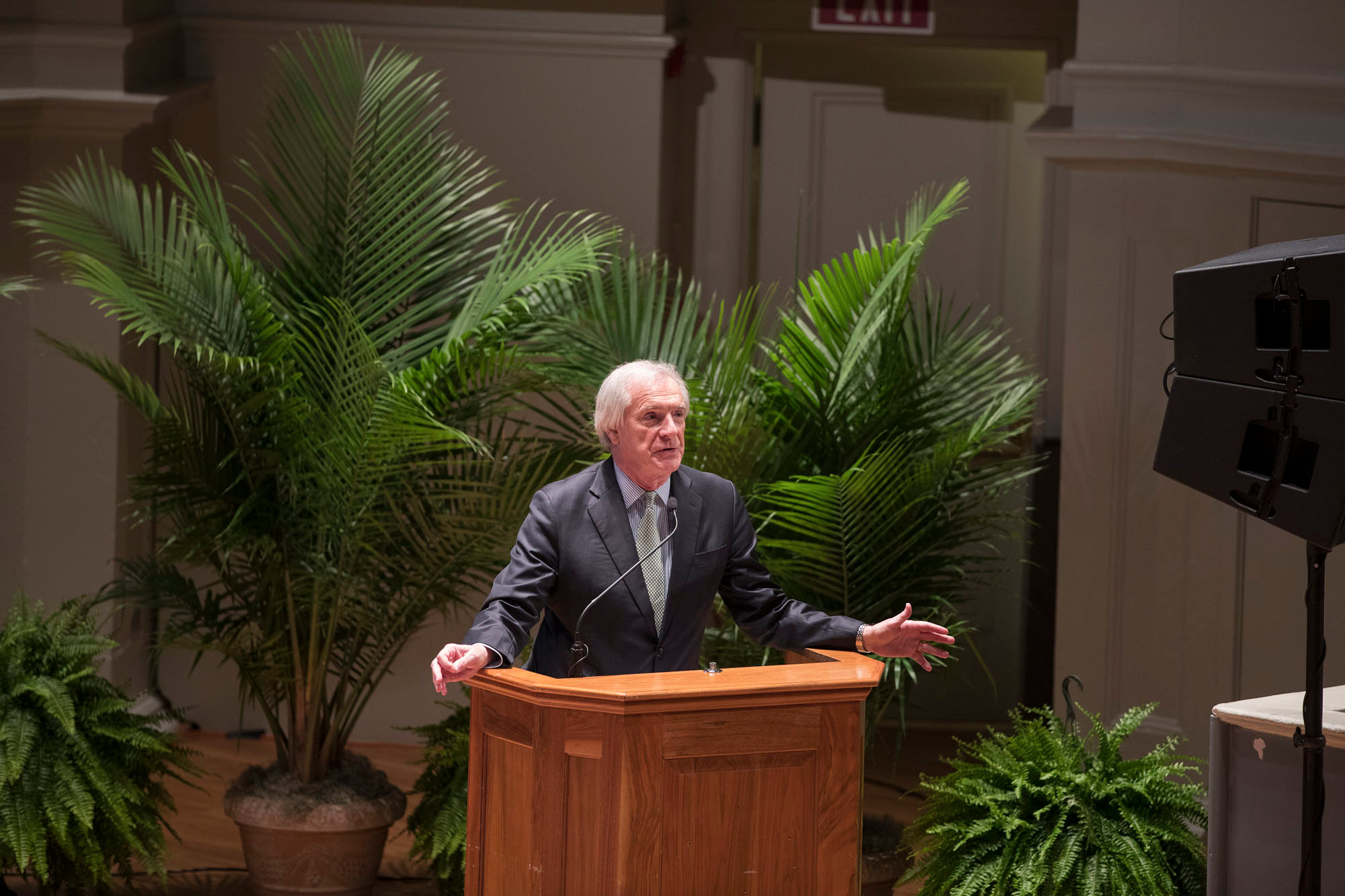 Carl Zeithaml, dean of the School of Commerce, addresses the audience before faculty members take the stage.