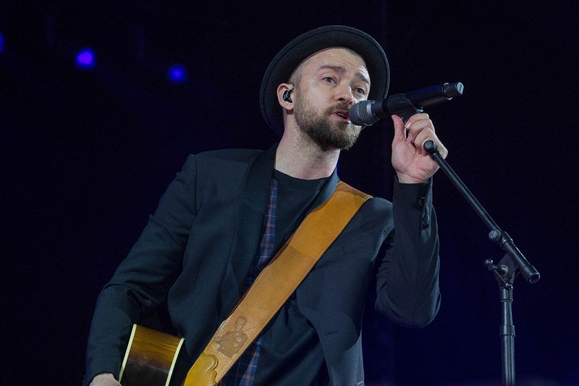 Justin Timberlake sings into a microphone