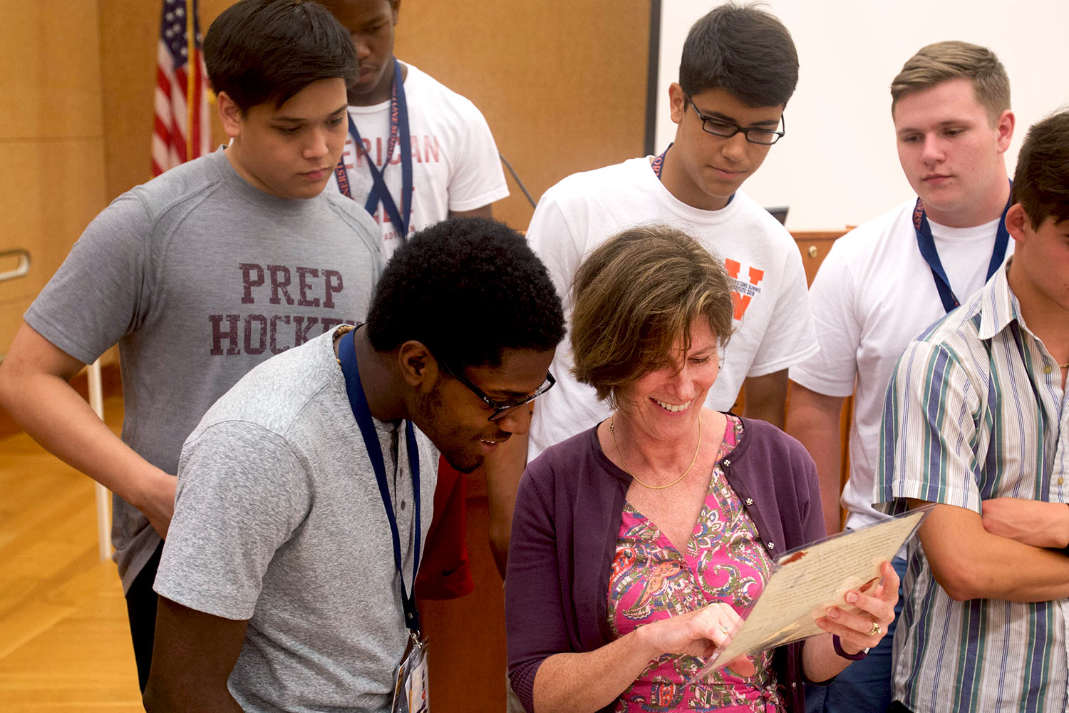 Riser, center, shows another Jefferson letter to Shawn Thomas of Woodbridge, left, and other students at the Cornerstone Summer Institute. (Photo by Sanjay Suchak/University Communications)