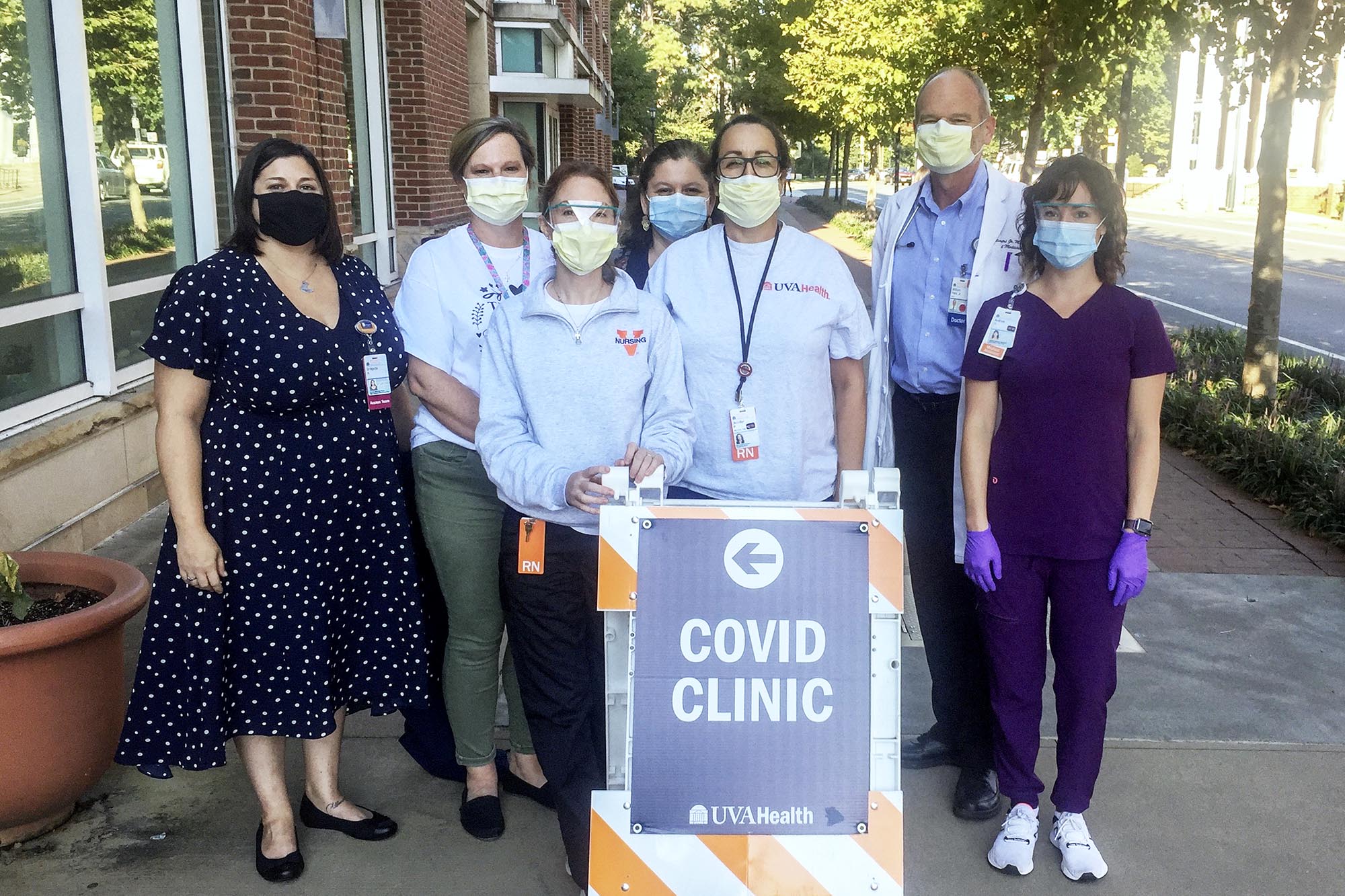 Bridgette Arlook, Christy Breeden, Rebecca Wade, Crystal Reed, Jennifer Pinnata, William Petri Jr. and Andrea Stanley pose together for a photo at a Covid clinic