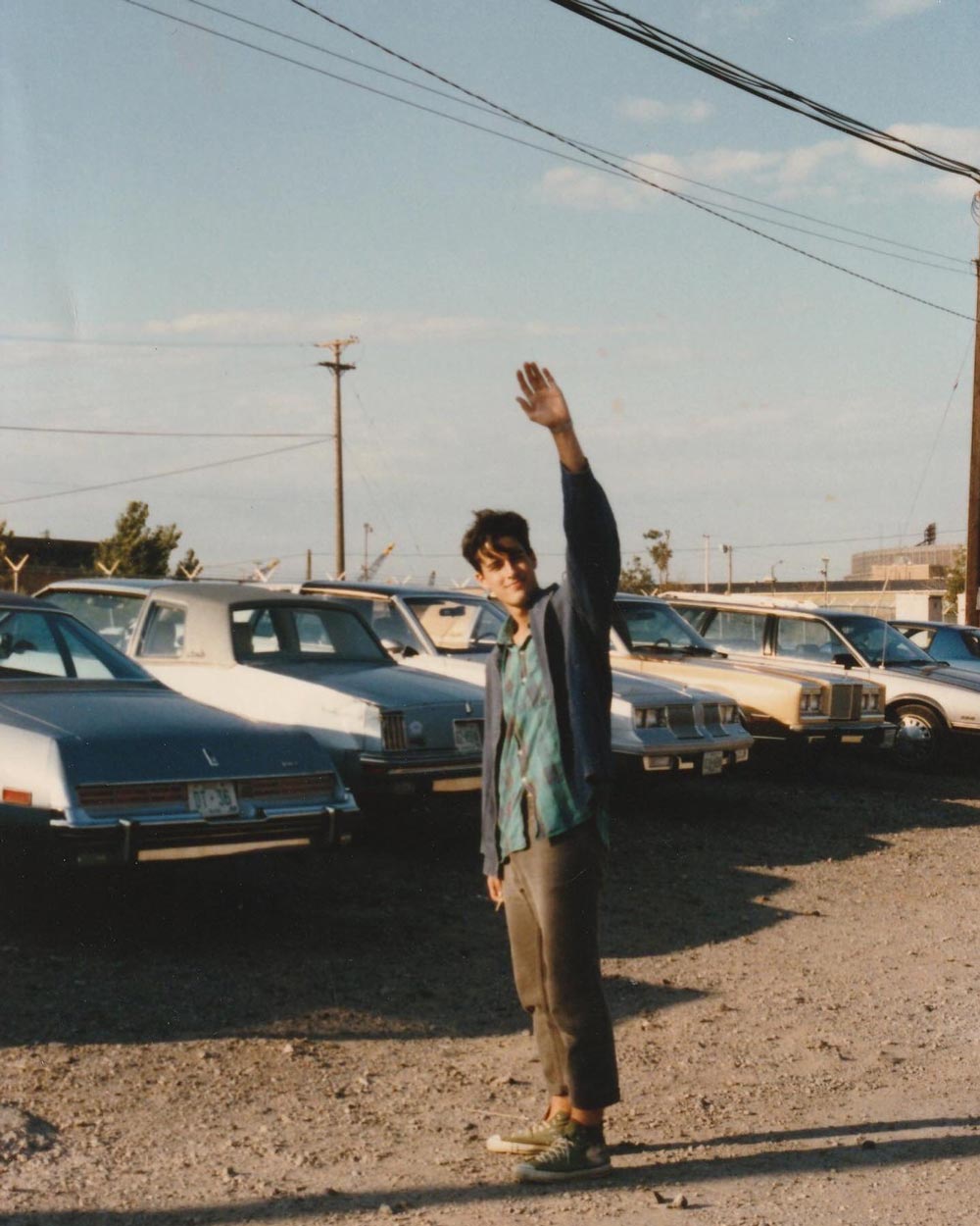 Old image of David Berman waving his hand in the air