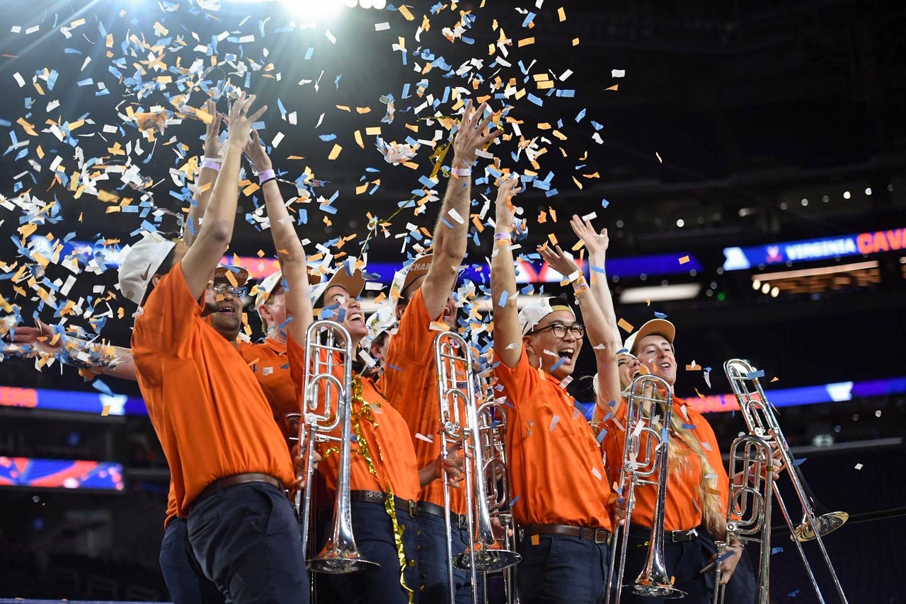 Shim, center, relished the moment with his fellow trombonists as the confetti fell in Minneapolis after the UVA men’s basketball team’s NCAA title win.